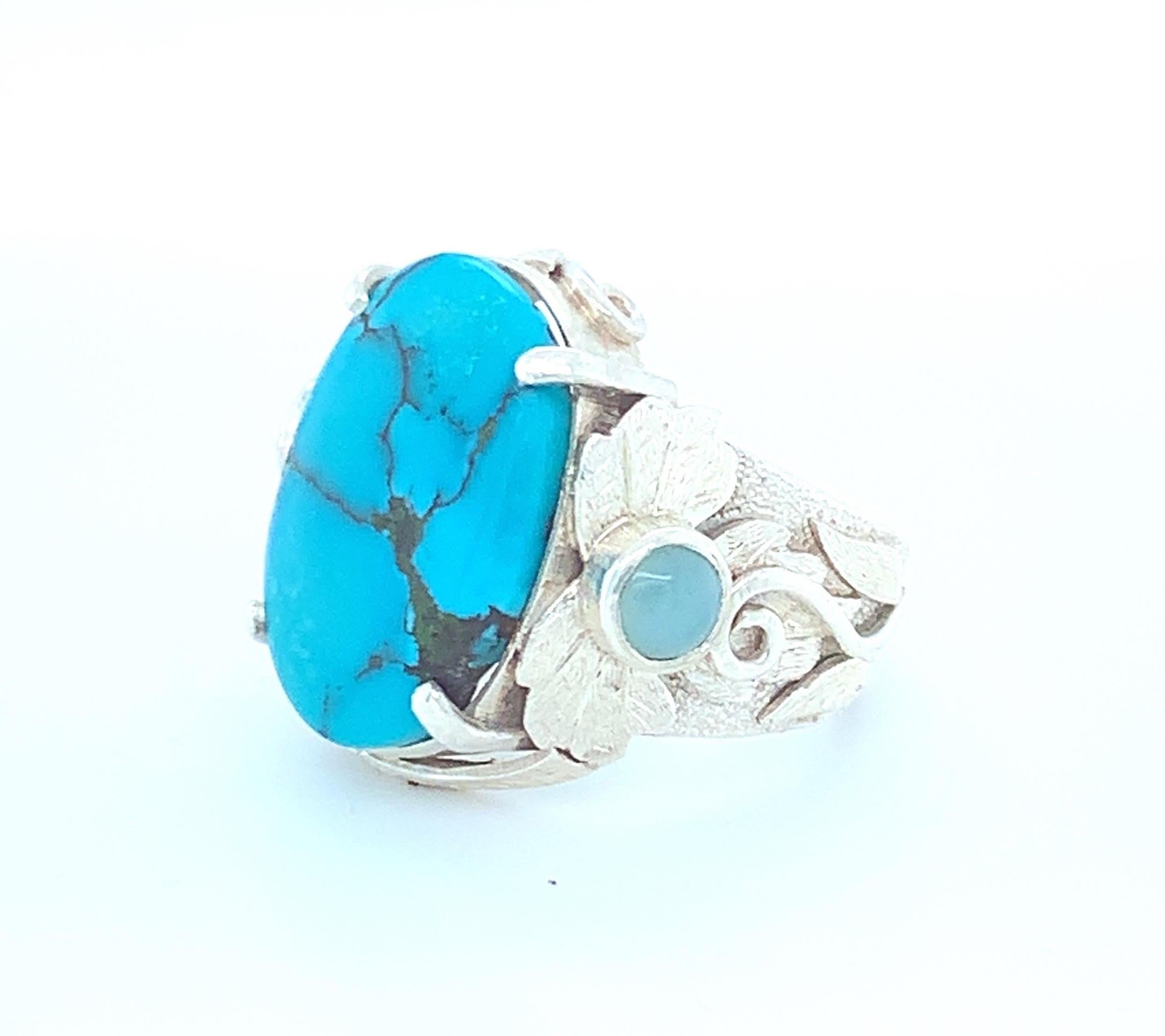 Oval turquoise is set in prong setting with blue tiny round onyx on each side of this cocktail ring. Multi-layered work is done on this one of a kind ring. This ring is carefully made with hand in sterling silver.
Natural turquoise (not powered