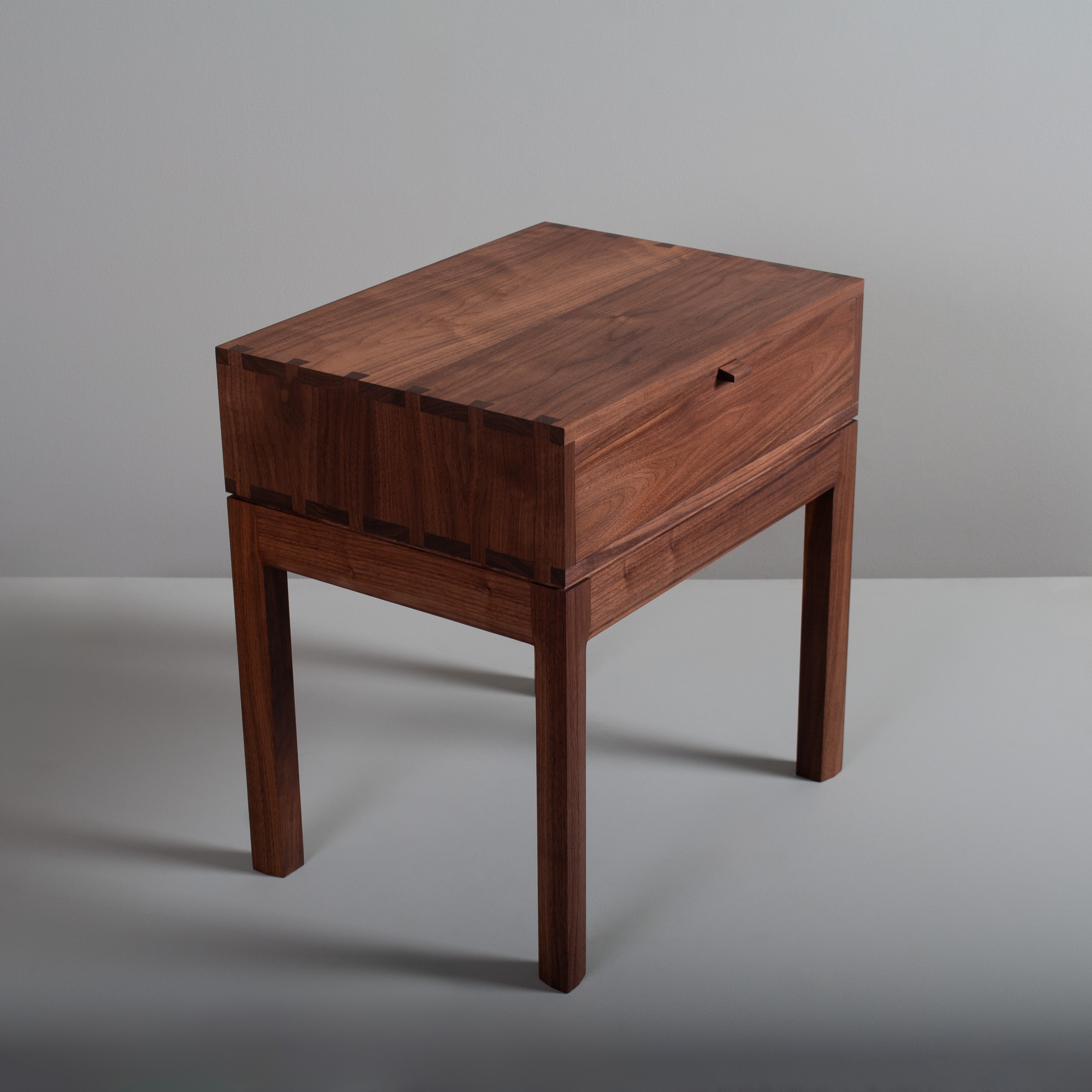 This is a one-off showroom sample sale of our Prime American black walnut hand-crafted night stands or end tables. These are constructed from the finest American black walnut with the inner dovetailed jointed traditional drawer carcass in