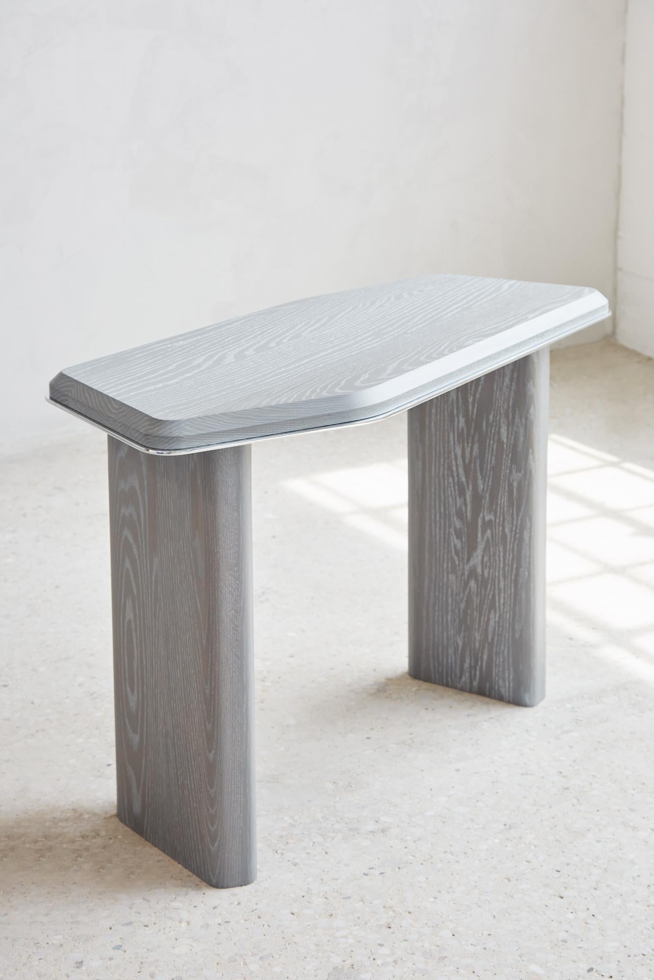 GEOMORPH CONSOLE TABLE
Designed to be used as a console or desk, this piece is inspired by metamorphic rocks that have grown, evolved, and combined with other materials over time. Just as these rock formations incorporate other substances, the