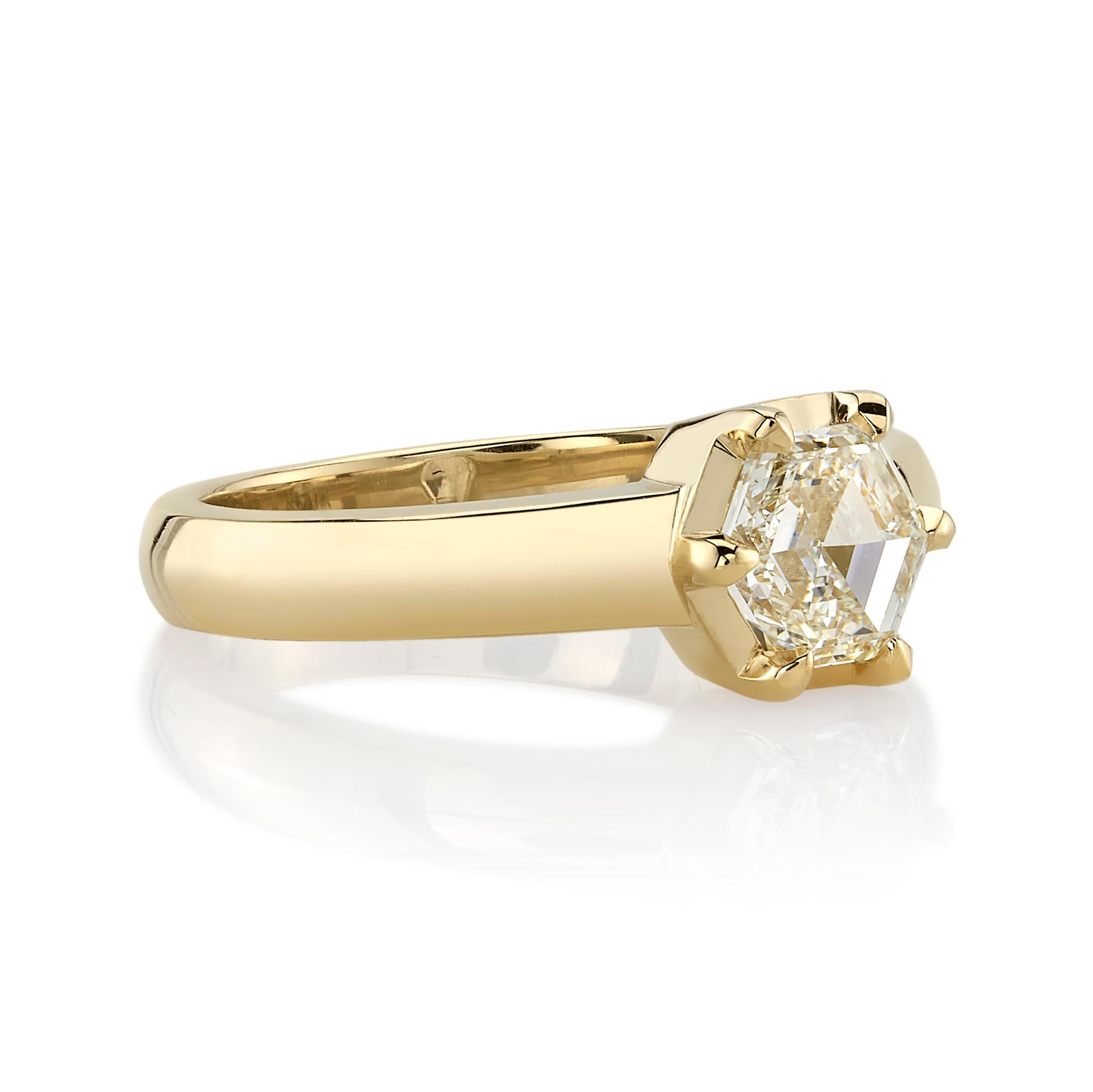 1.01ct K/VS1 GIA certified hexagonal step cut diamond prong set in a handcrafted 18K yellow gold mounting.