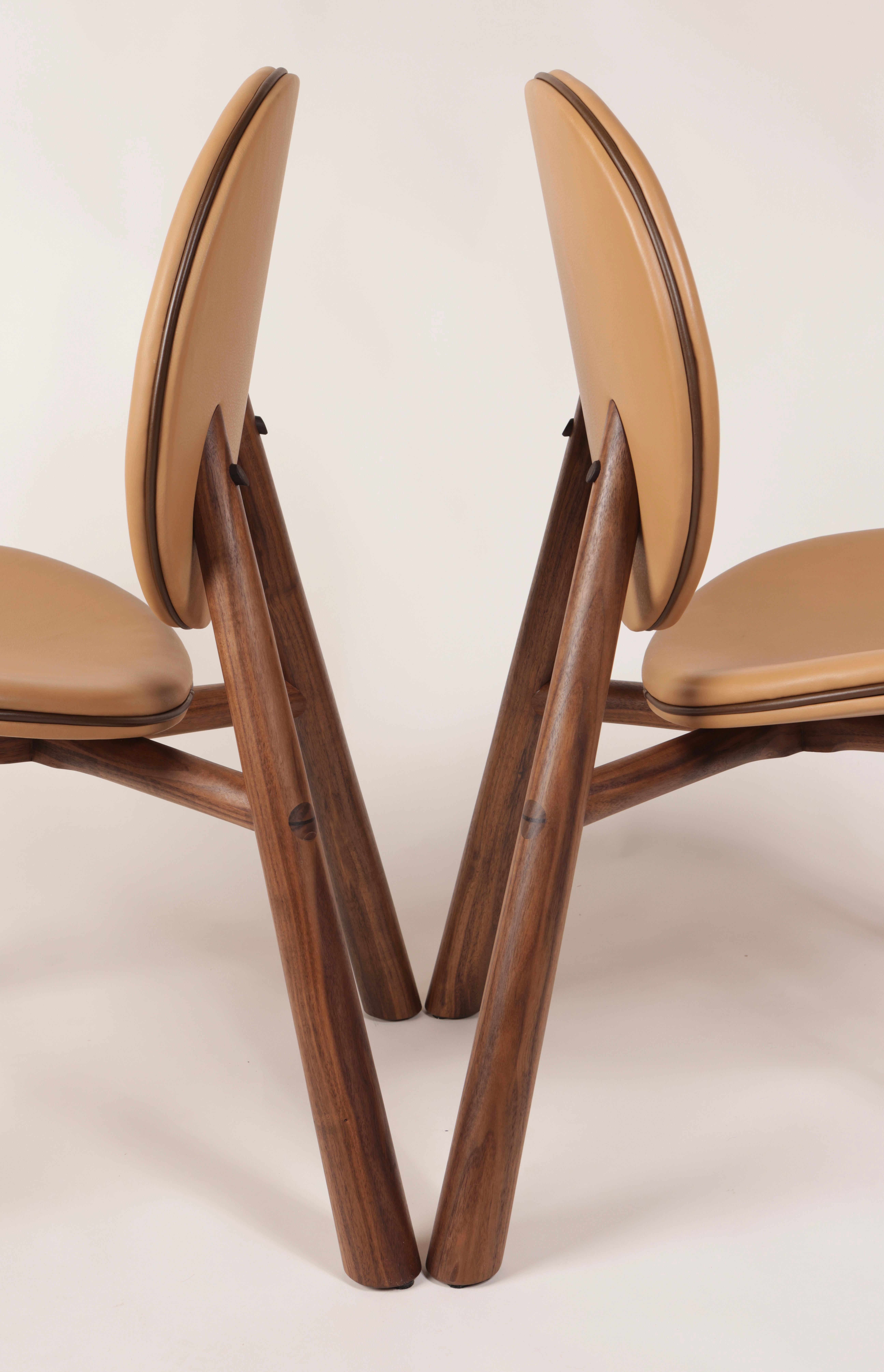 The Opus - a luxurious and playful chair huge on comfort. A modern design that showcases both a hand-turned, solid-wood frame and bespoke upholstery.  

Chairs are built to order in 4-5 weeks. Wood species include American Black Walnut (pictured),