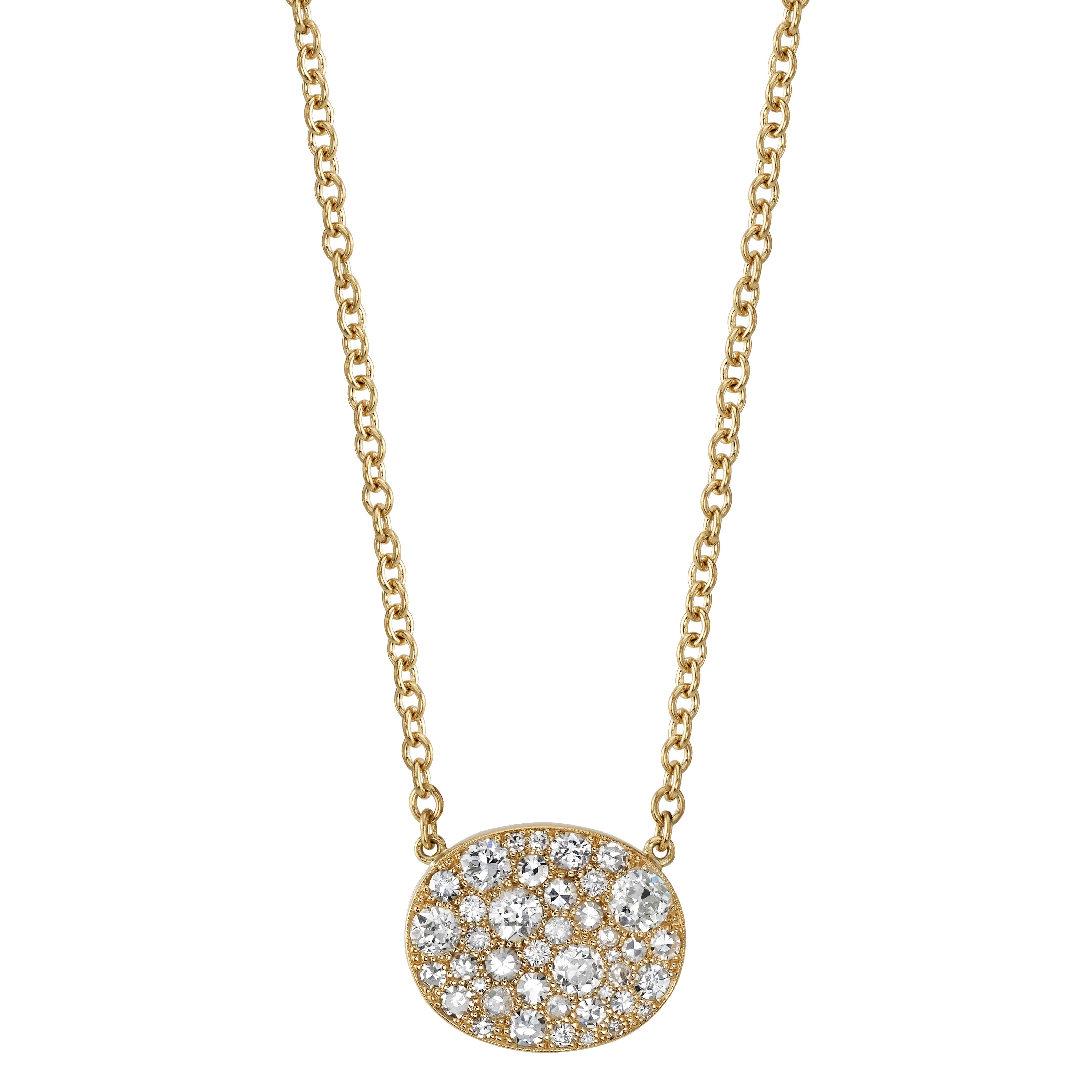 Approximately 1.80ctw varying old cut and round brilliant cut diamonds in a handcrafted 18K oxidized yellow gold pendant. Price may vary according to total diamond weight. Necklace includes 18