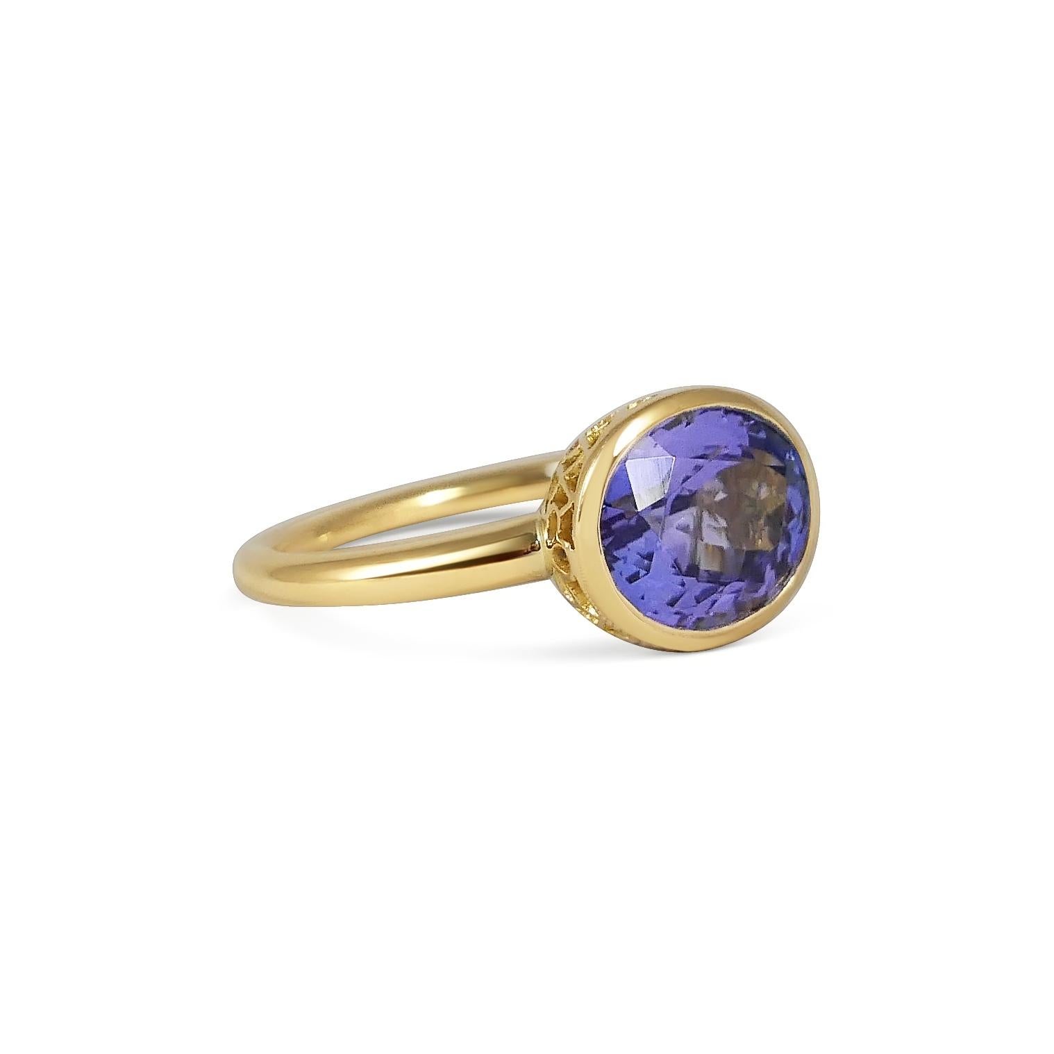 Handcrafted Oval Cut 4,70 Carats Tanzanite 18 Karat Yellow Gold Cocktail Ring. Our expert craftsmen hand pierce our iconic gold lace to fit each stone on a tapered band making each ring One of a Kind. This unique technique, inspired by our