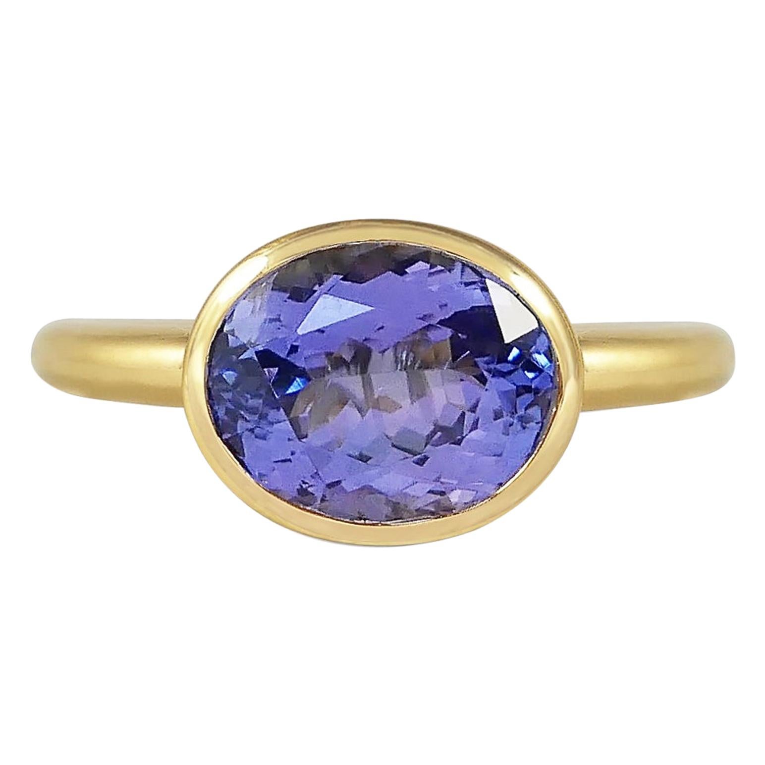 Handcrafted Oval Cut 4.70 Carats Tanzanite 18 Karat Yellow Gold Cocktail Ring