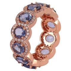 Anillo artesanal de zafiro ovalado con diamante talla redonda brillante