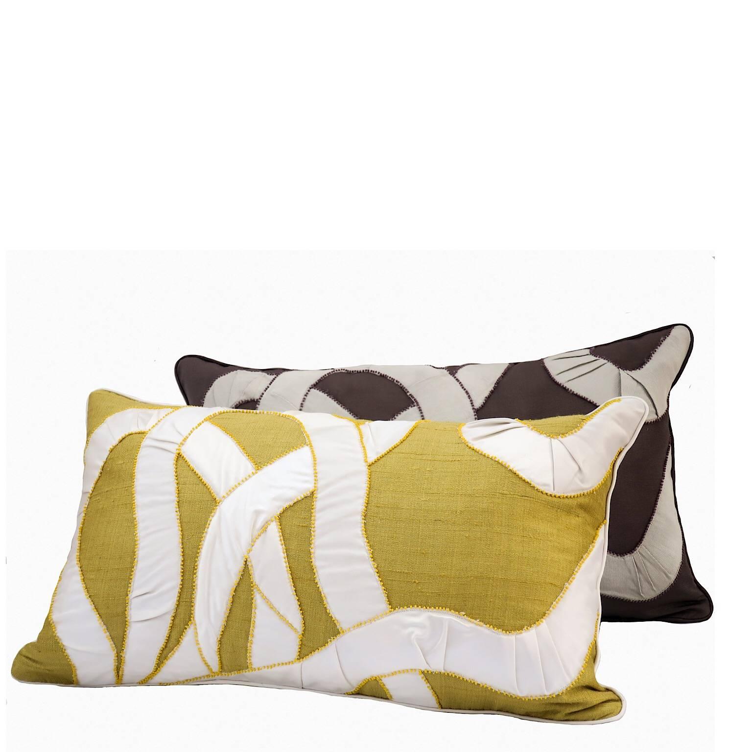 Handcrafted pillow hand appliquéd faille in contrast color with matt bead edging
yellow and off white. Dedar fabrics.
Feather pad.