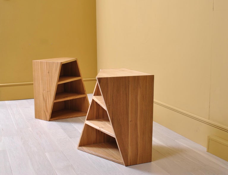 The acute twisted angle design plays on the eye in a similar fashion to the Penrose and Escher staircase. The shelf fronts have a twisting beveled edge that neatly turns to meet the side uprights. These are bold visual pieces of furniture that are