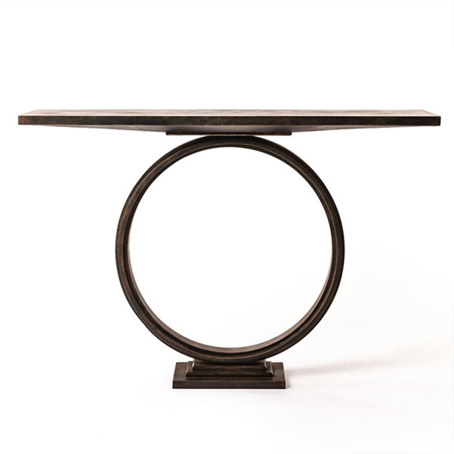 Elegant and timeless in design, the Ra console table is made up of several multi-stranded rings forged together to create a stunning, round base on which the top appears to float. Shown here in bronze finish and metal top.

Designed and