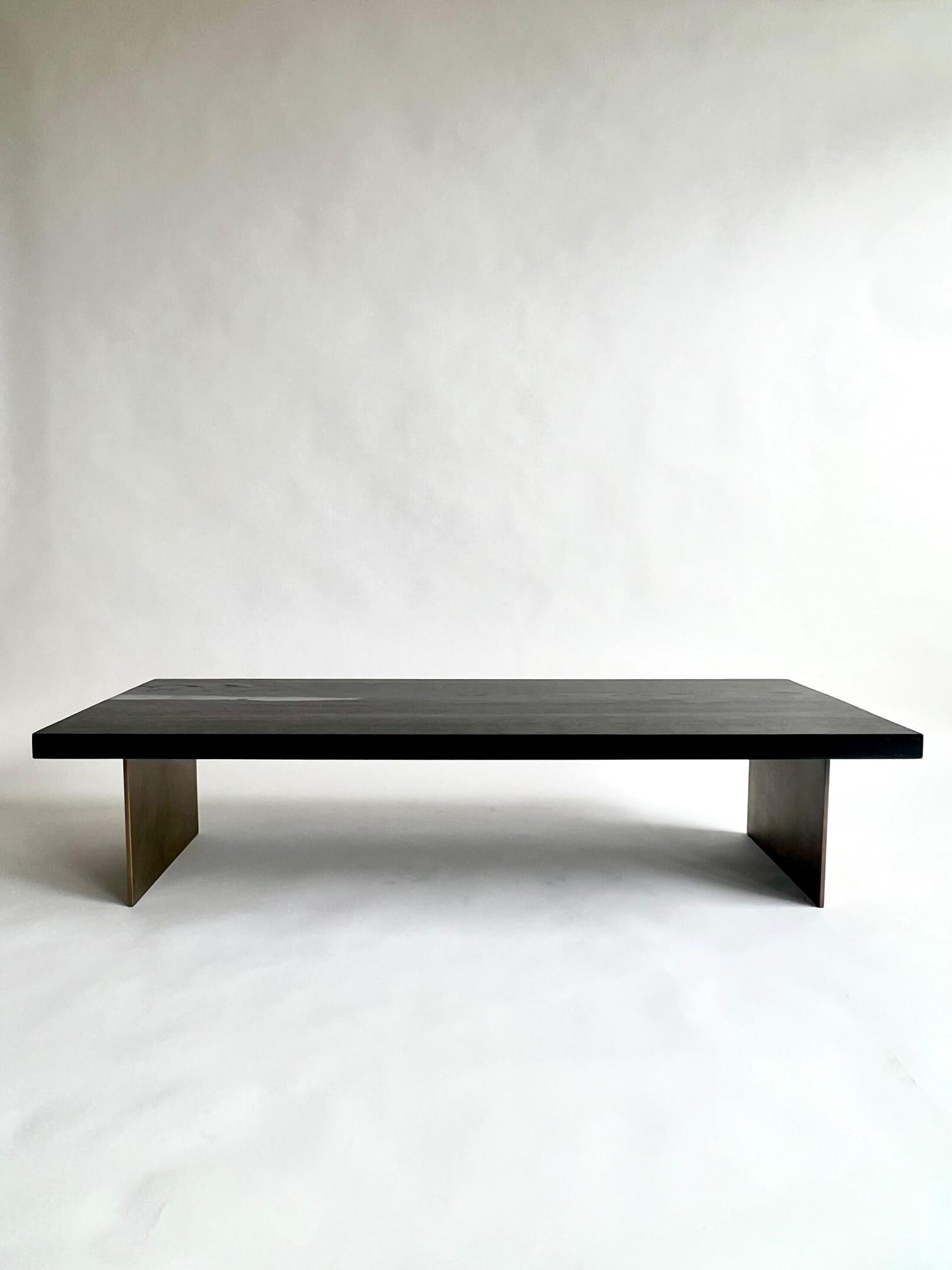 Introducing an extraordinary coffee table carefully crafted from ancient Bog Oak and strong epoxy resin. This remarkable piece showcases wood that is an astonishing 7,000 years old, sourced from Romania. The wood's incredible preservation is thanks