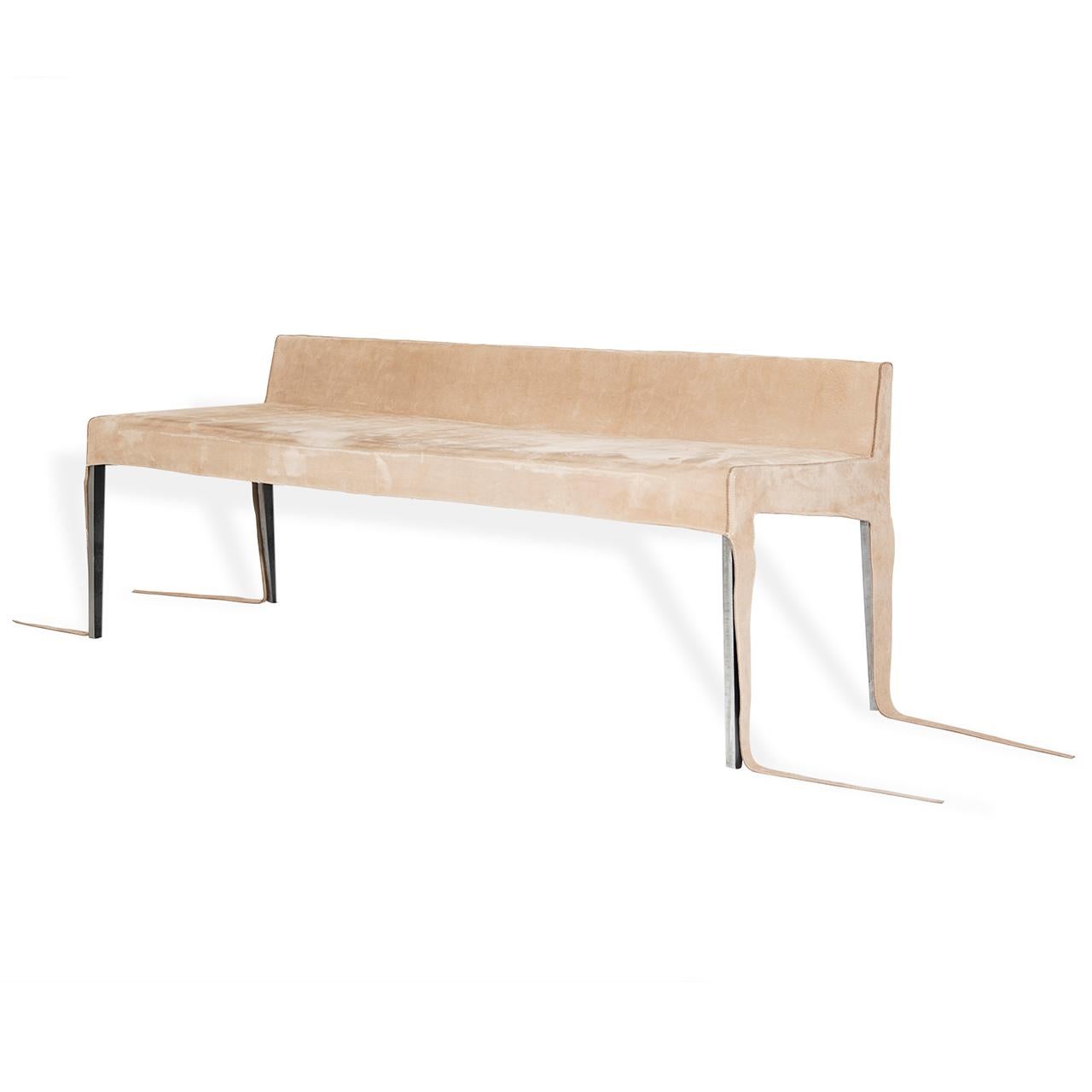 A sleek design bench with a wood and soldered steel frame with suede cover. Intended for interior use and perfect for a reception or gallery area. COM fabric and bespoke measurements available.