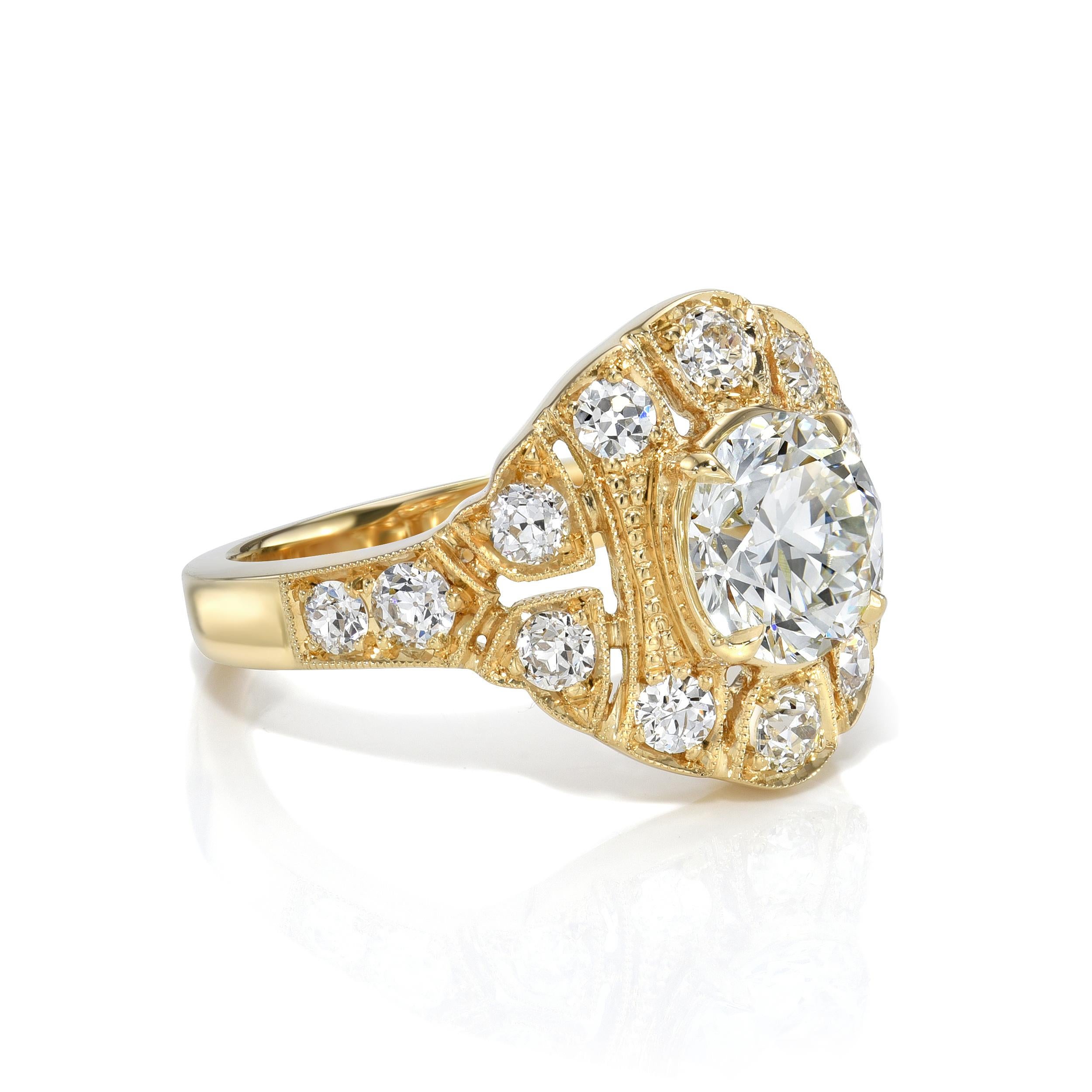 1.33ct H/VS1 GIA certified transitional cut diamond prong set with 0.78ctw old European cut accent diamonds set in a handcrafted 18K yellow gold mounting.