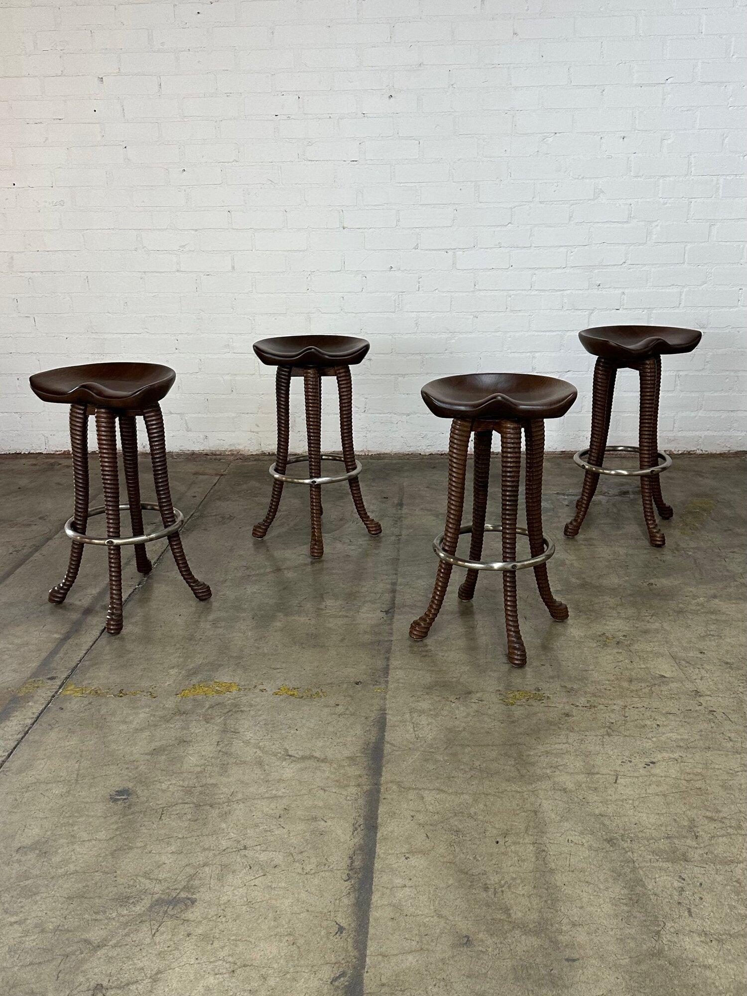 W17 D17 H31 SW17 SD13 SH29

Fully refinished set of four barstools. Handcrafted out of solid oak and stained in a medium walnut finish. Barstools feature hand carved ribbed legs with a patinated chrome ring. 

circa 1940’s

