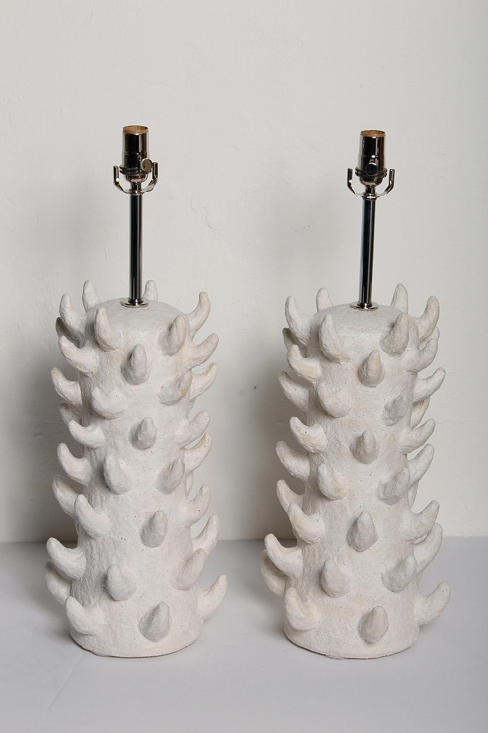 Pair of custom white salt-glazed stoneware lamps, handcrafted exclusively for Stripe by ceramicist Priscilla Hollingsworth. Polished nickel hardware with white fabric cords. Height measurement below is to top of socket.