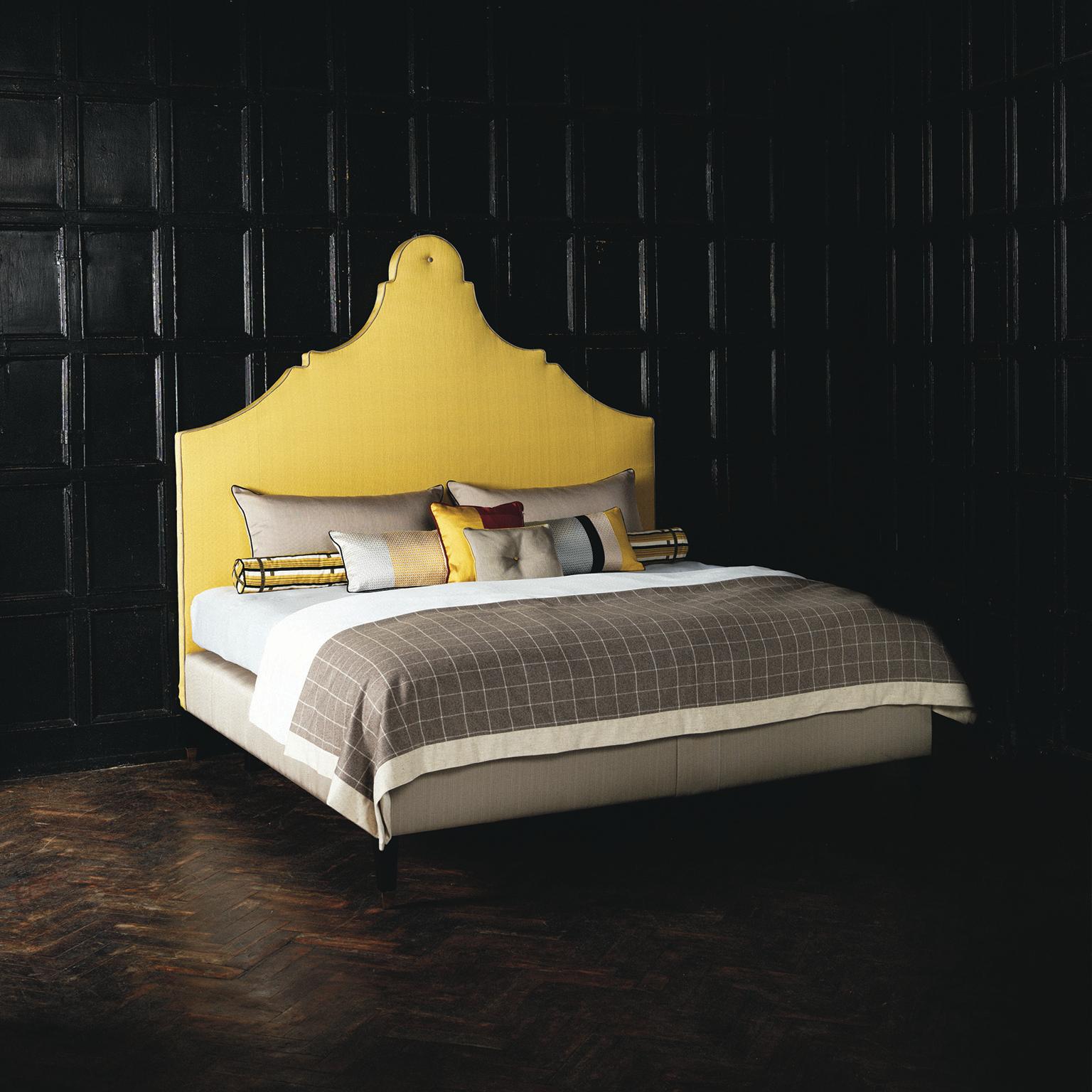 A traditionally shaped headboard with elegant curves and an eye-catching colour palette, the Claudia bed makes a statement. Upholstered in lemon yellow with a contrasting taupe base, the design is finished with crisp piping and a feature button.