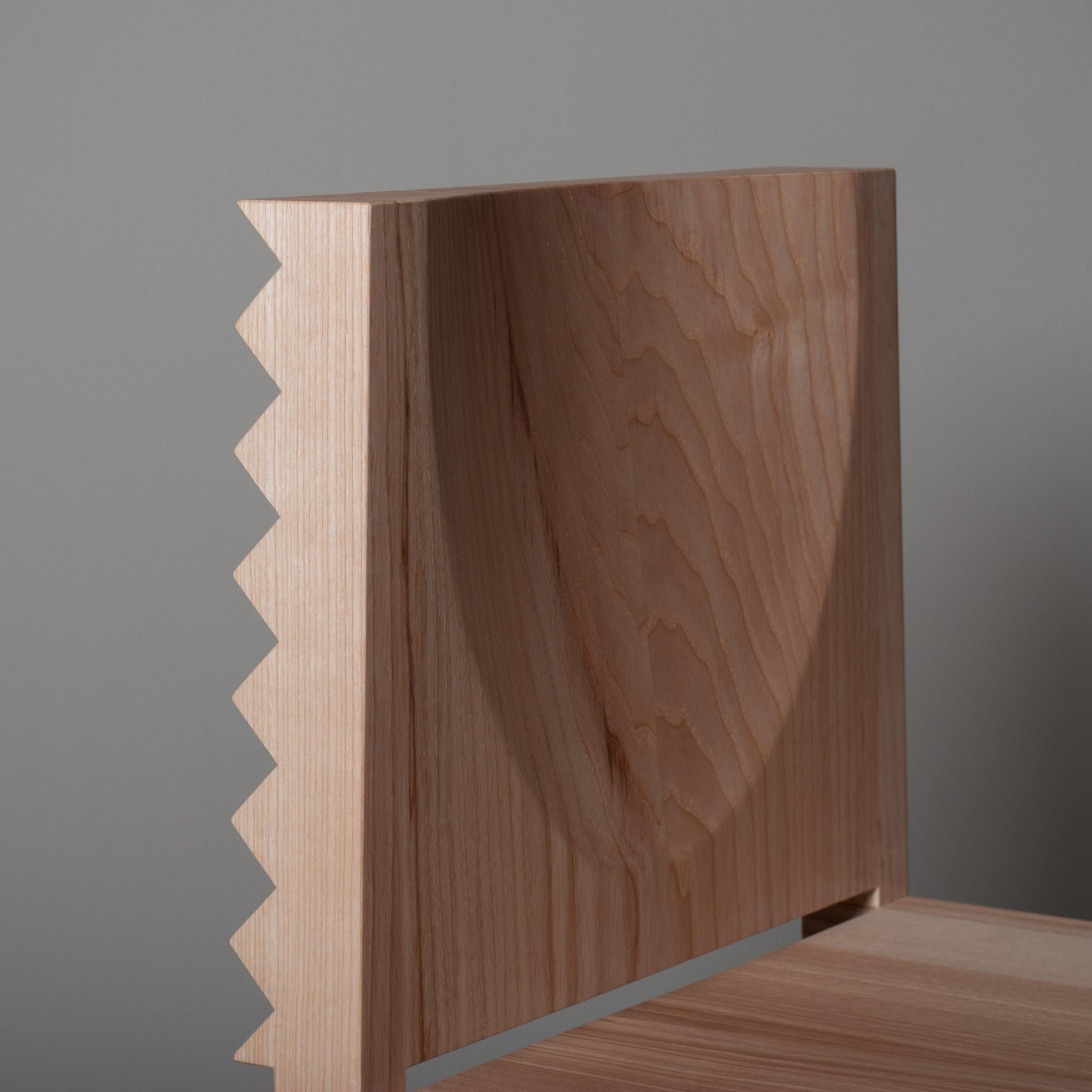 Solid English Ash 'Sawtooth' dining chair with a radical and robust signature design by James Torble.
As dining chairs are typically viewed from behind - these have a magnificent sawtooth relief cut into the back of them. The chair features