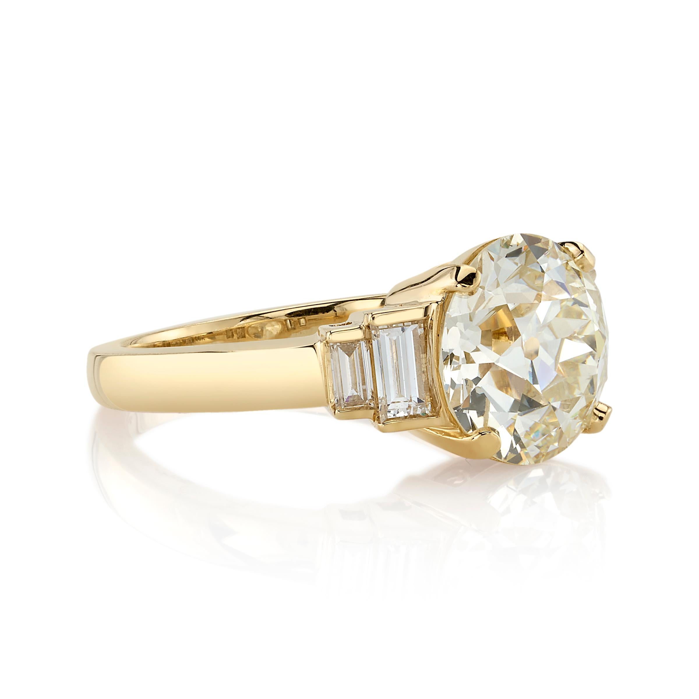 3.47ct L/VS1 GIA certified old European cut diamond with 0.44ctw baguette cut diamond accents set in a handcrafted 18K yellow gold mounting.

\