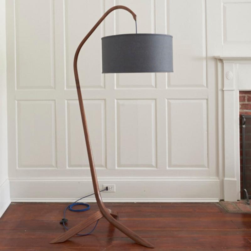 The Willow standing lamp makes an elegant statement in your room. Handcrafted of steam bent walnut with an integrated cord, foot switch and charcoal grey shade. The shade and cord can be customized. Designed by Daniel Oates in 2015.

We use UL