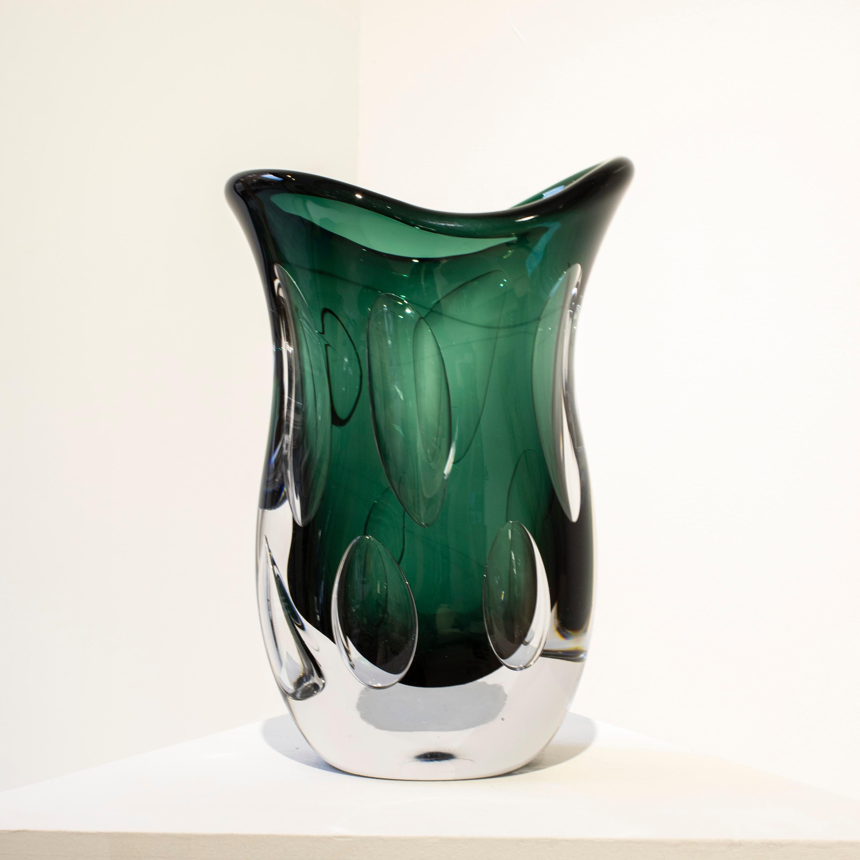 Hand-blown Italian green semi-transparent glass vase with organic shapes and inside bubbles.
