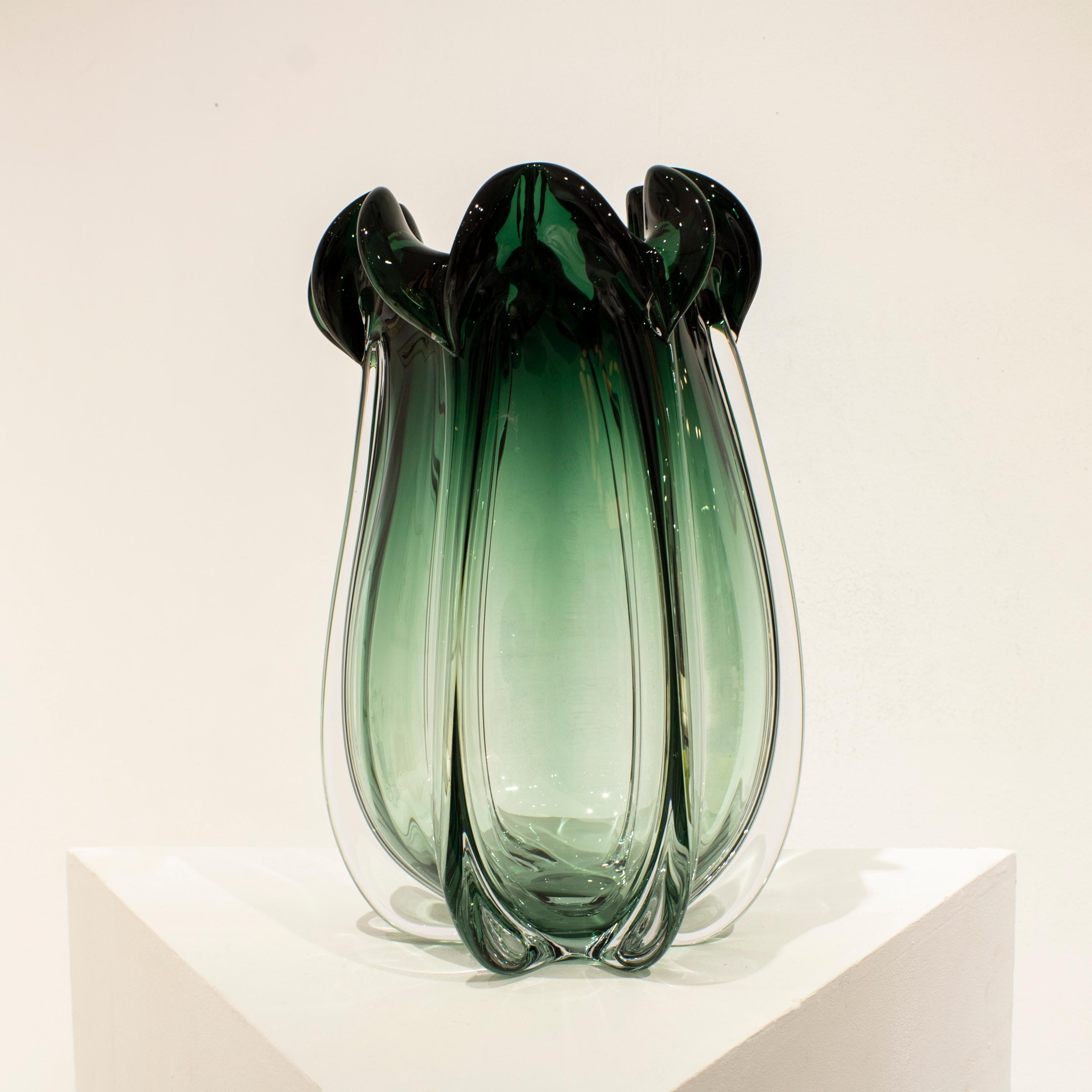 Hand-blown Italian green semi-transparent glass vase, with organic shapes inspired by nature. 