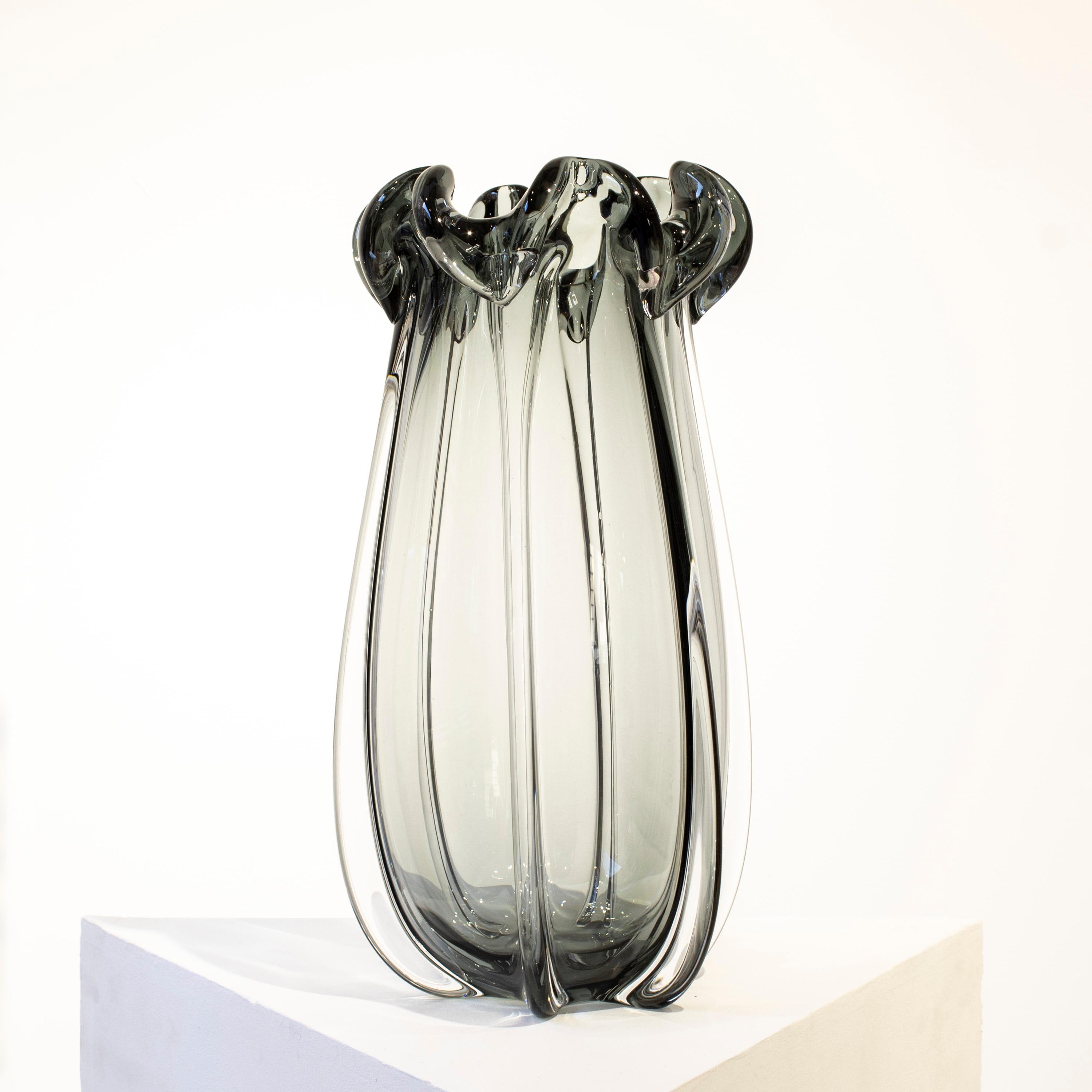 Hand-blown Italian grey semi-transparent glass vase, with organic shapes inspired by nature. 