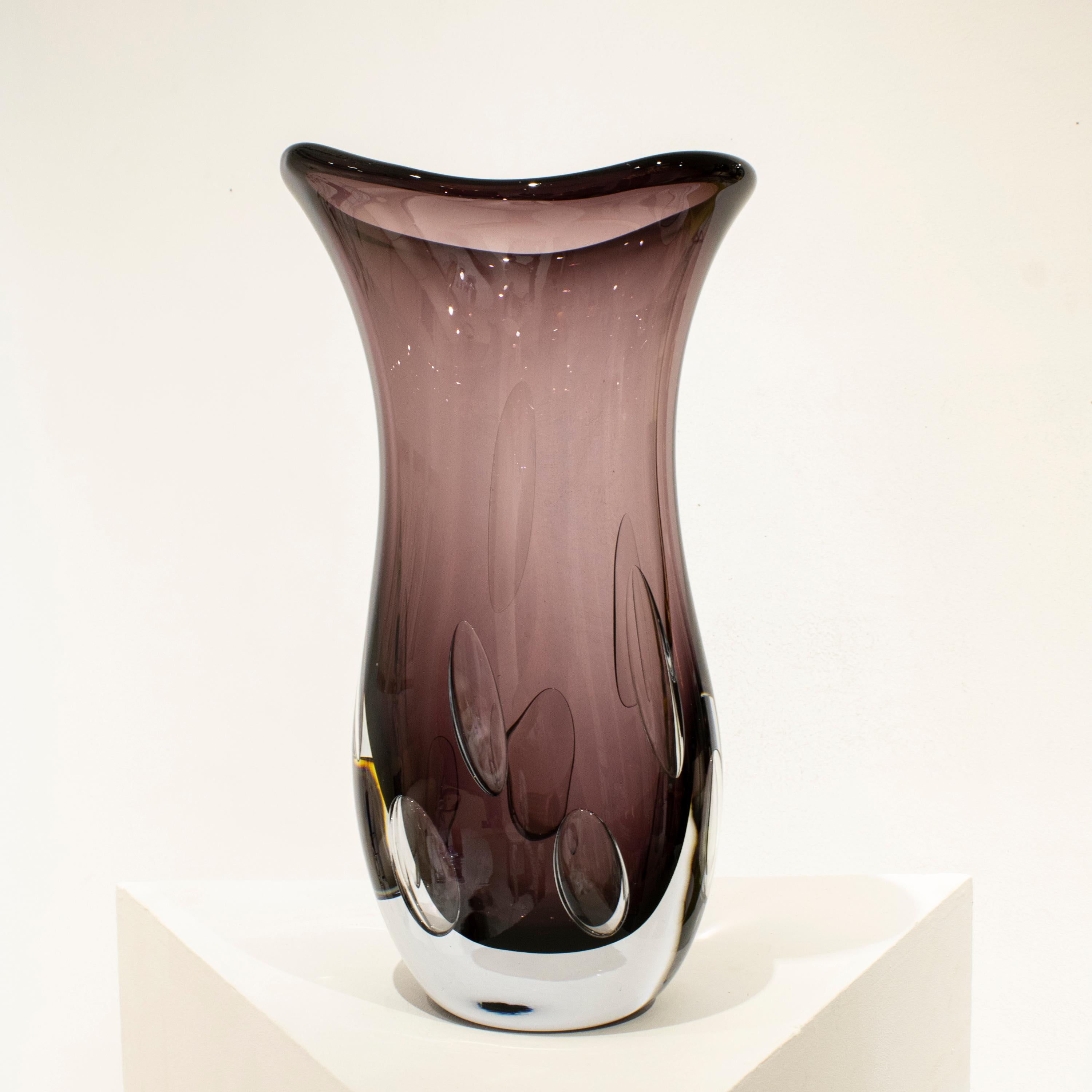 Hand-blown Italian magenta semi-transparent glass vase, with organic shapes and inside bubbles.