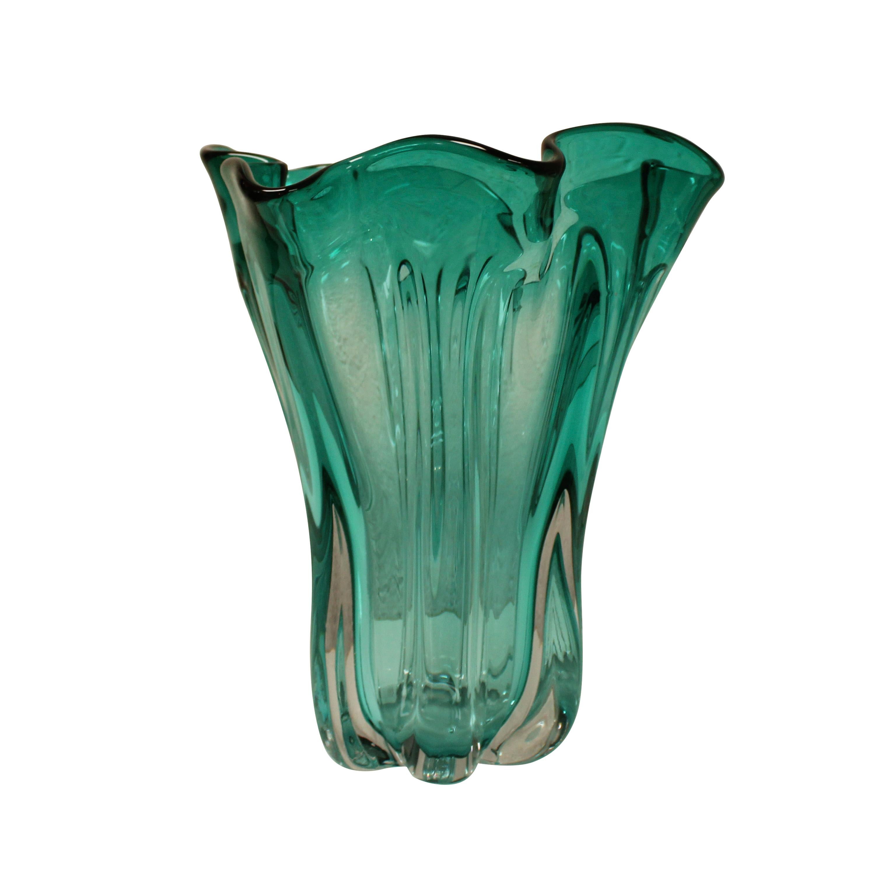 Hand-blown Italian turquoise semi-transparent glass vase with an organic nature-inspired shape.