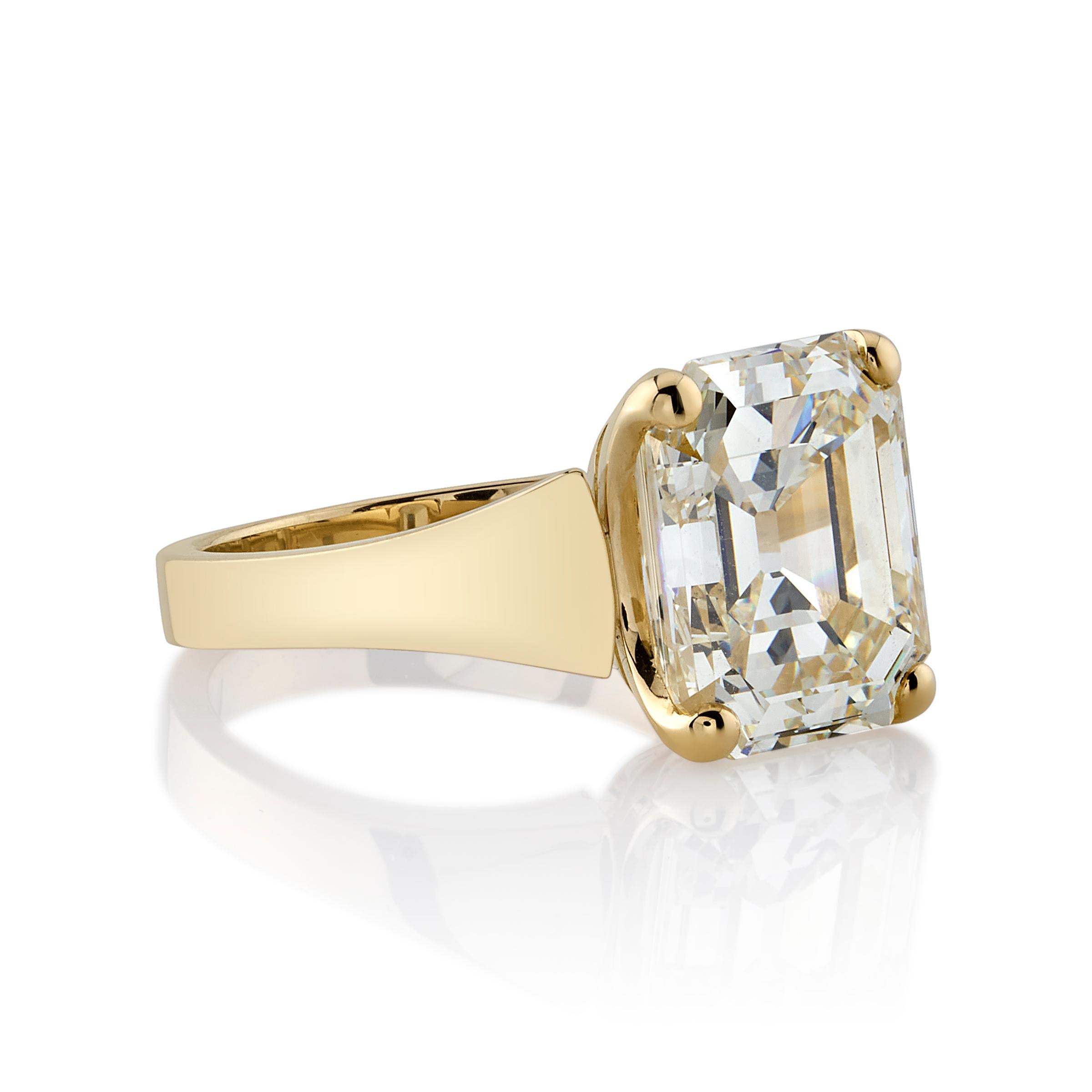 6.00ct N/VS1 GIA certified rare antique emerald cut diamond prong set in a handcrafted 18K yellow gold mounting.

