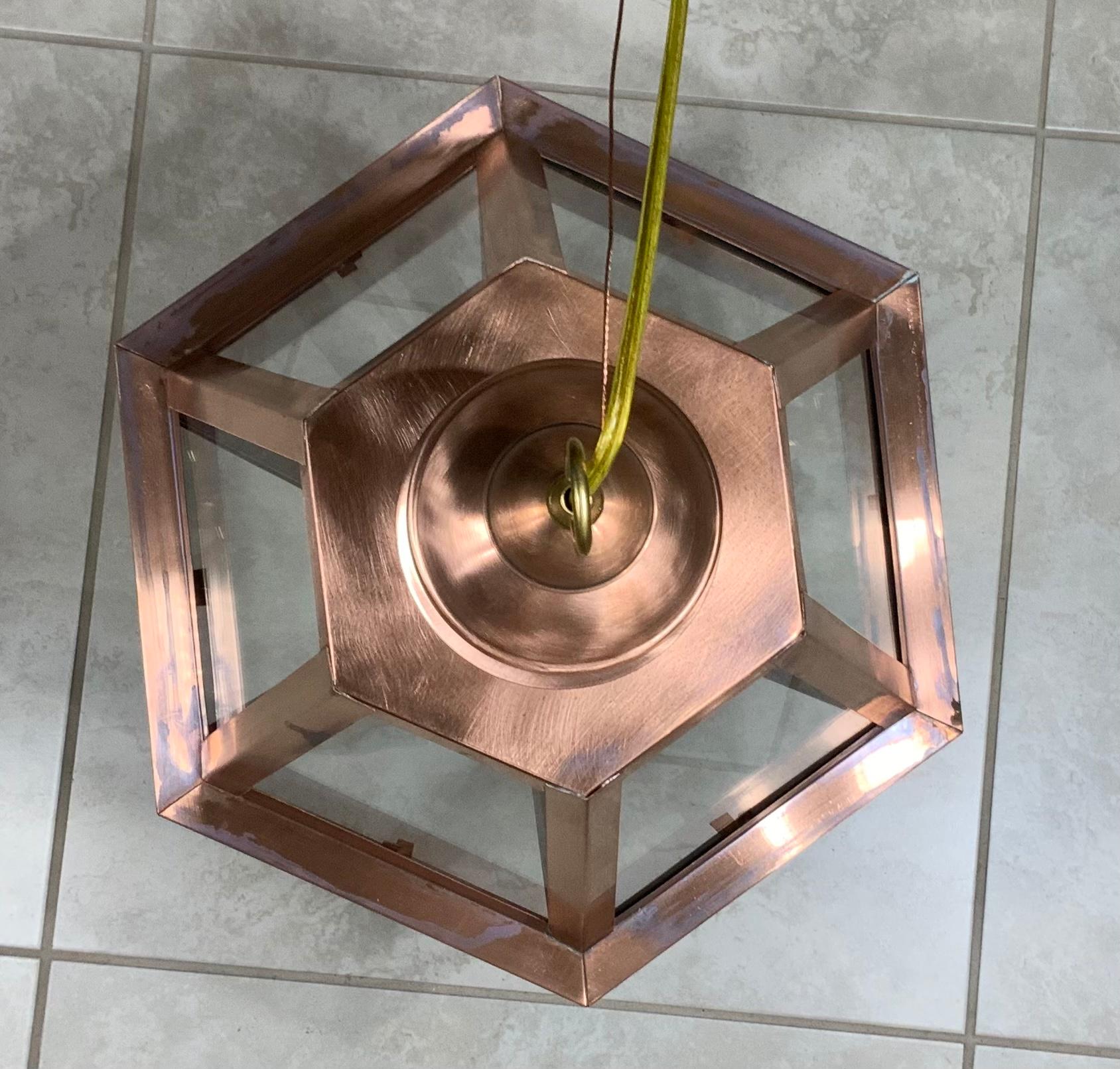Exceptional six side custom made hanging lantern made of handcrafted solid copper and brass stem with four 60/watt lights, suitable for wet location
Up to US code, UL approved, great look indoor outdoor. Copper canopy and chain included.