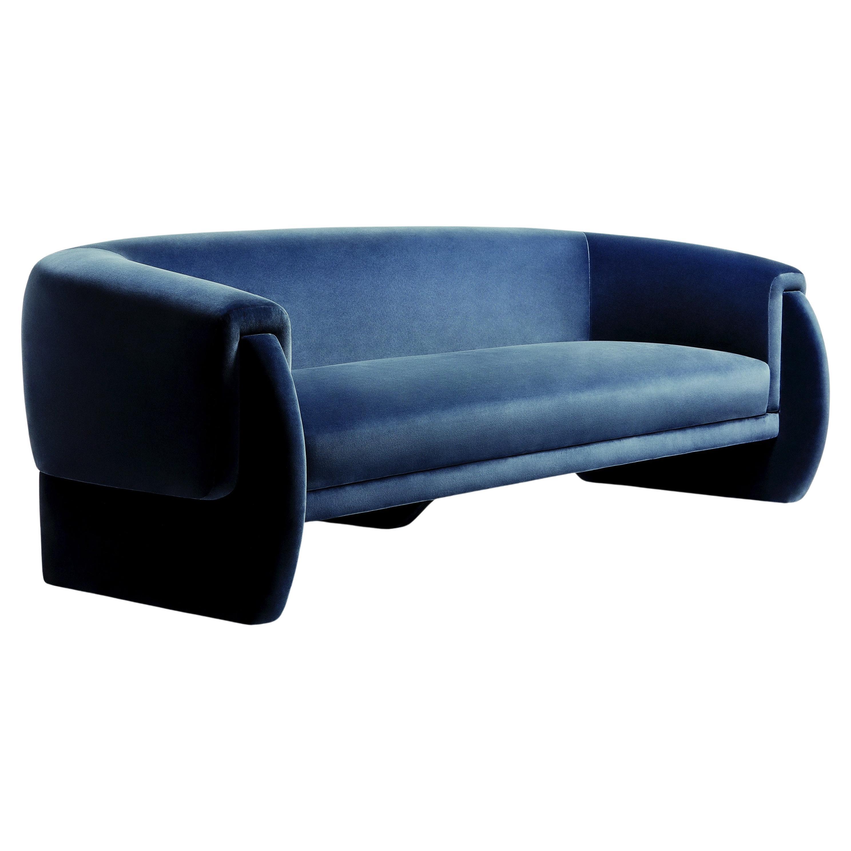 This sofa is a time capsule of style. Taking cues from the most fashionable scarves in history, it’s subtle and layered composition create a dynamic and effortlessly stylish presence. From the half round composition of the arms, to its graceful seat