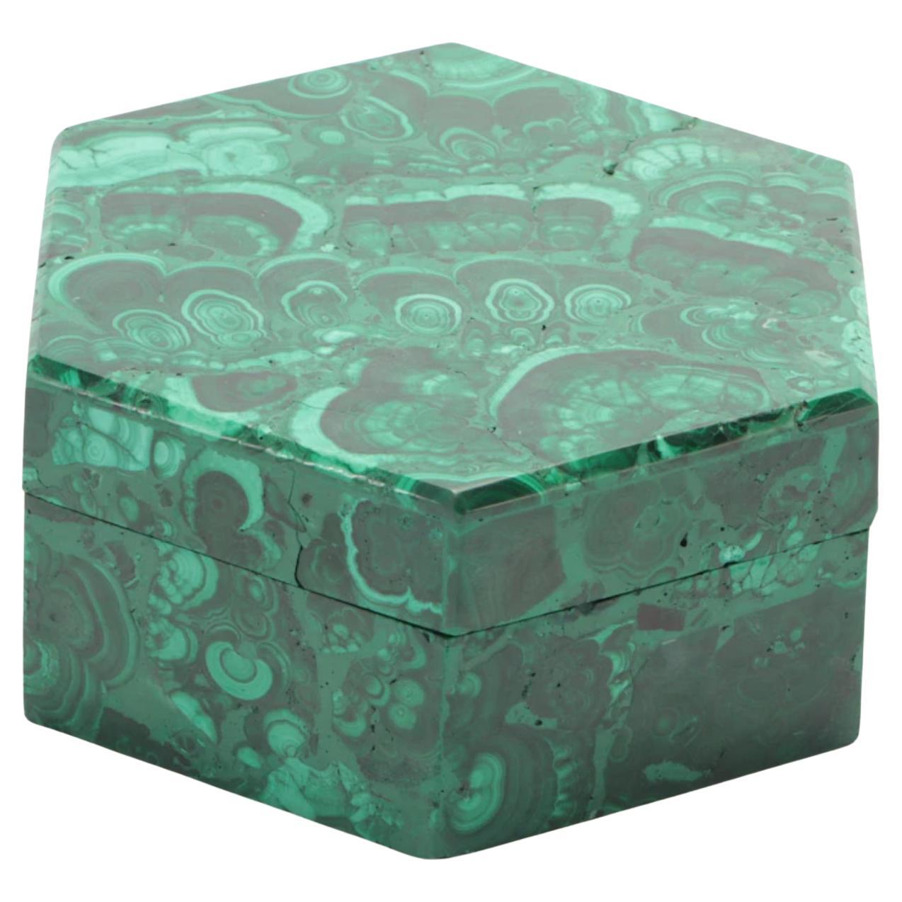 Gemstone quality lidded Malachite box. Hand carved and hand crafted with removable lid in a hexagonal shape. Beautiful patterns to the lid and box sides. Five inches wide and over five inches deep with a height of over two inches. Great jewelry or