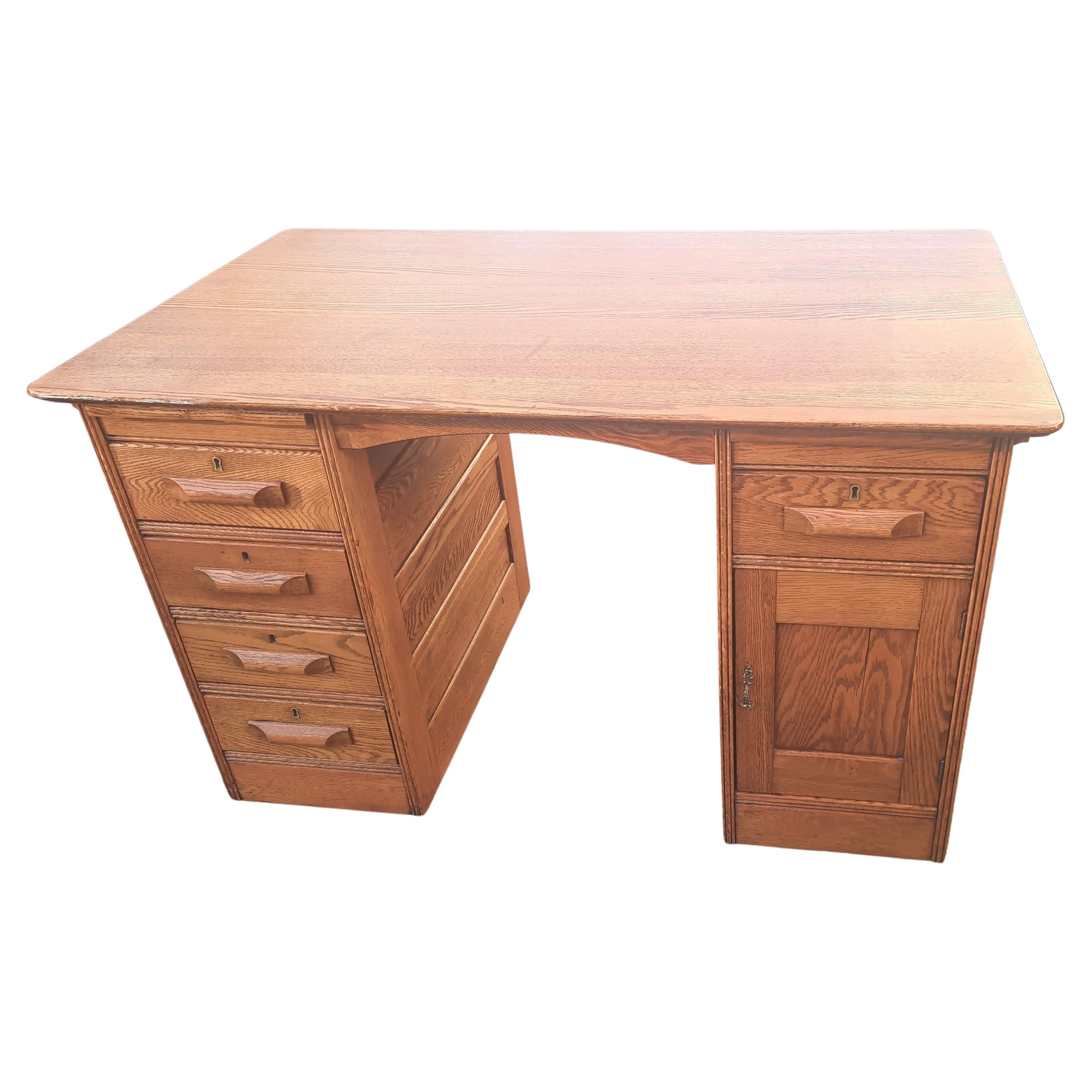 Modern comfort and Classic elegance combine in this handcrafted piece to make your house a home. Solid Red Oak. Solid handles. Plenty of storage with 5 dovetailed drawers with solid oak handles working smoothly. One divided cabinet with door for