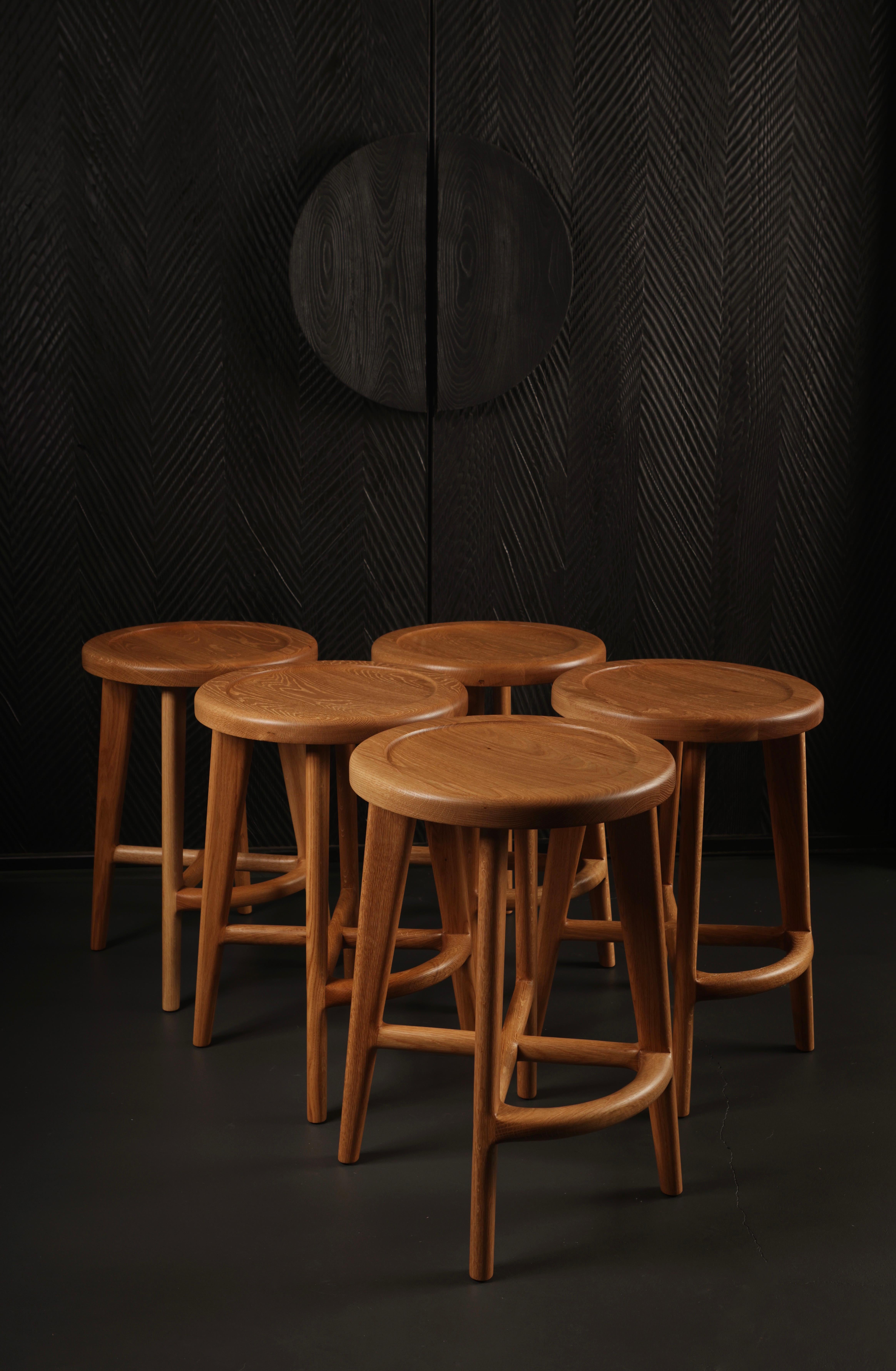 A classic design that will beautifully suit any home interior. Crafted from solid white oak, wood is hand-selected for colour uniformity and quality. Our bar stools feature generously sized seats, sculpted for comfort. The seamlessly integrated