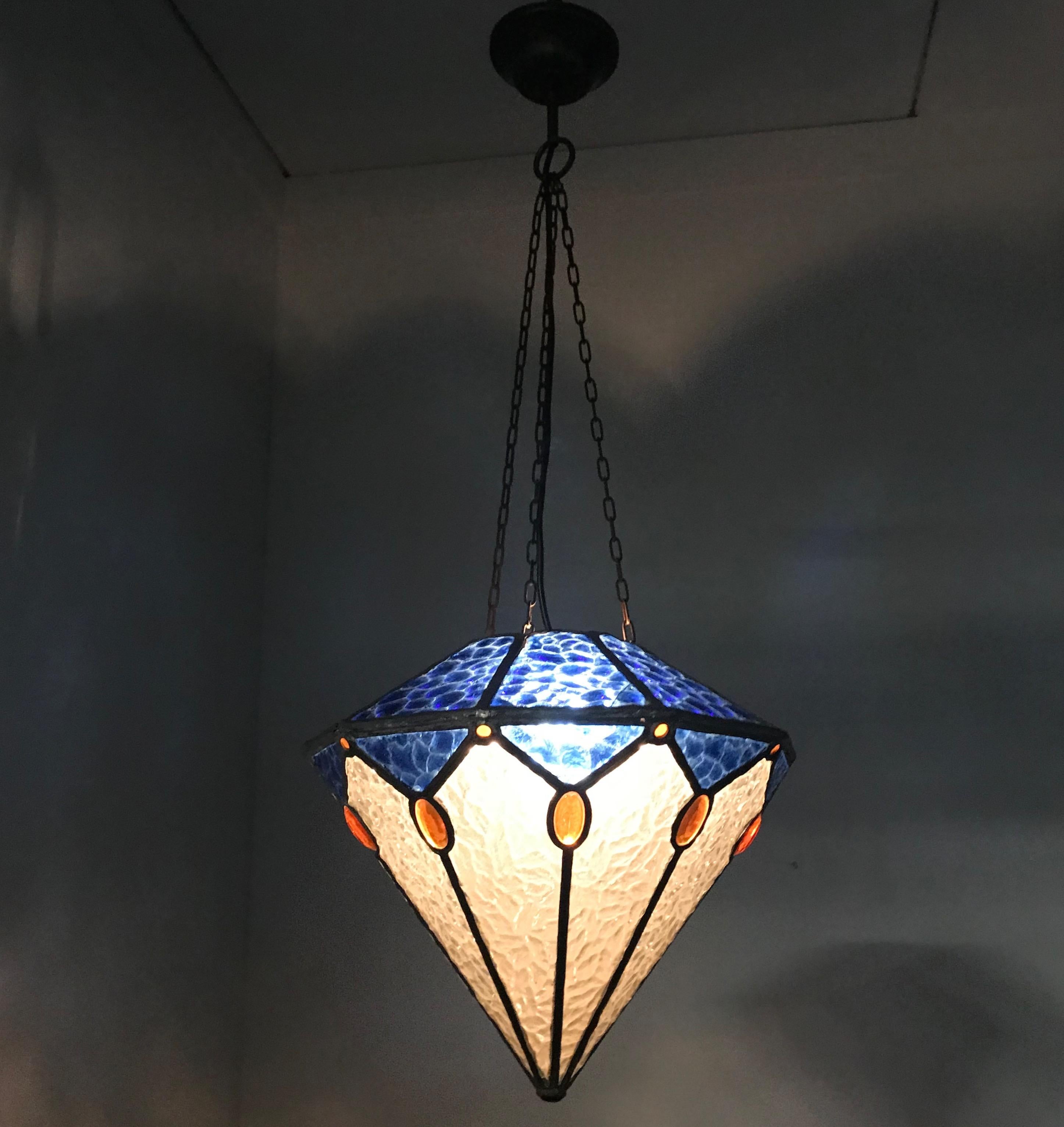 Wonderful ceiling lamp for the perfect ambiance.

If you are looking for a rare, beautiful and geometric design Art Deco pendant then this unique specimen from the 1920s could be the one for you. This diamant shape pendant has several stunning