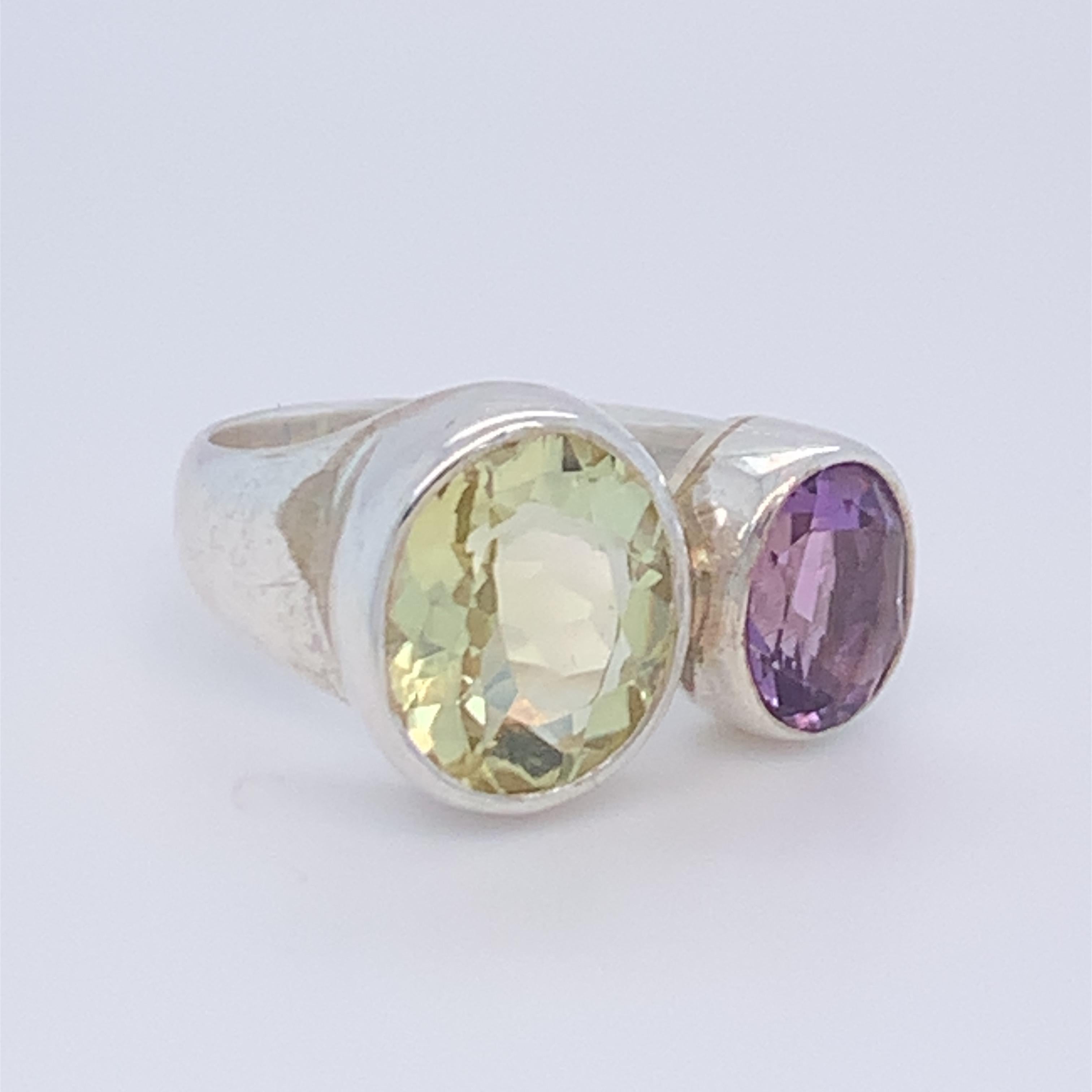 This beautiful two stone ring boasts two oval lemon citrine and amethyst. Birthstone of the month of February. it is simple, plain and suitable for day wear. Set in sterling silver and hand made by master craftsman.
Total weight of stone : 7.00ct