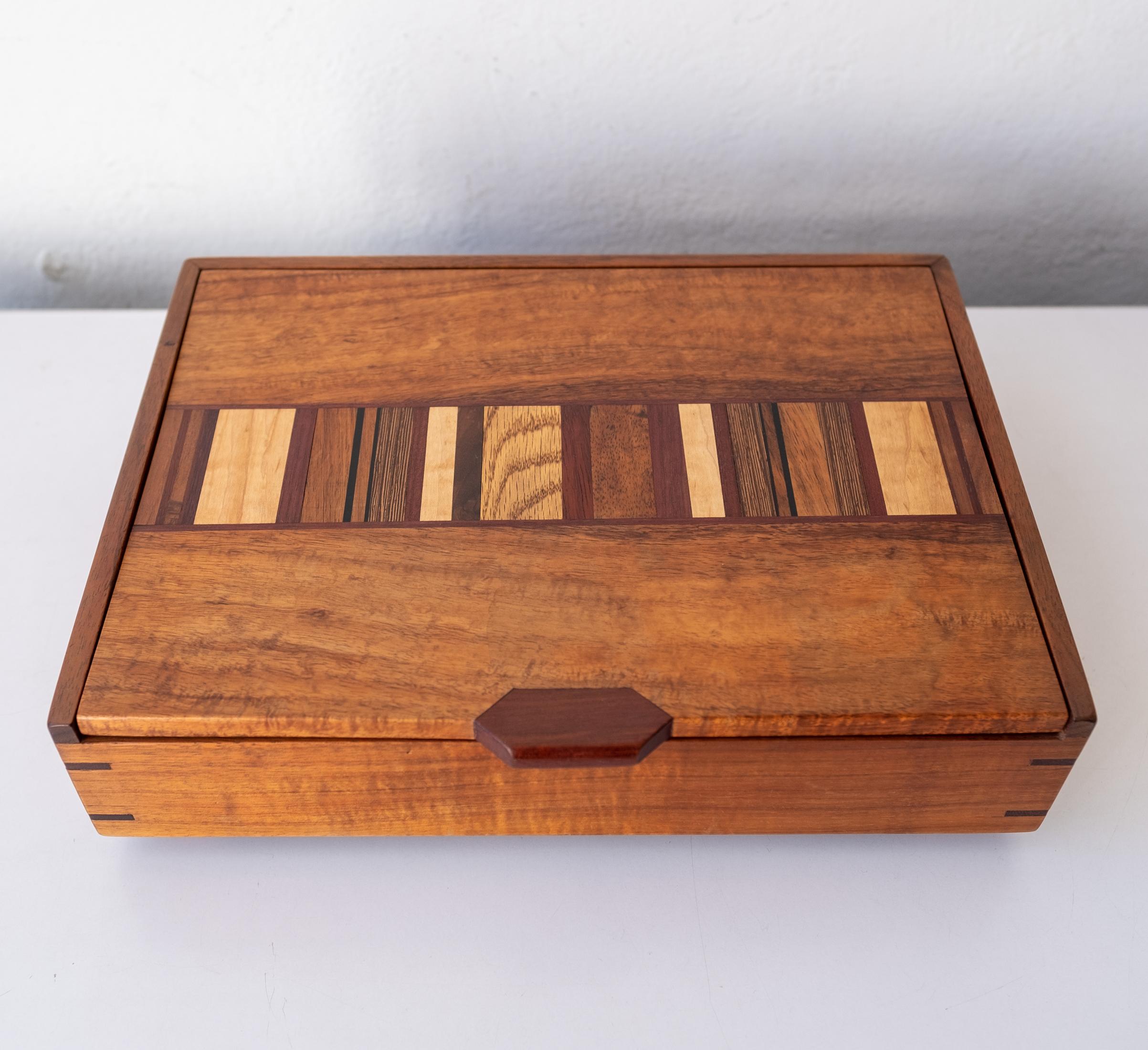 Amazing hand-crafted studio jewelry box. Mixed exotic wood with incredible joinery. Felt-lined dividers.