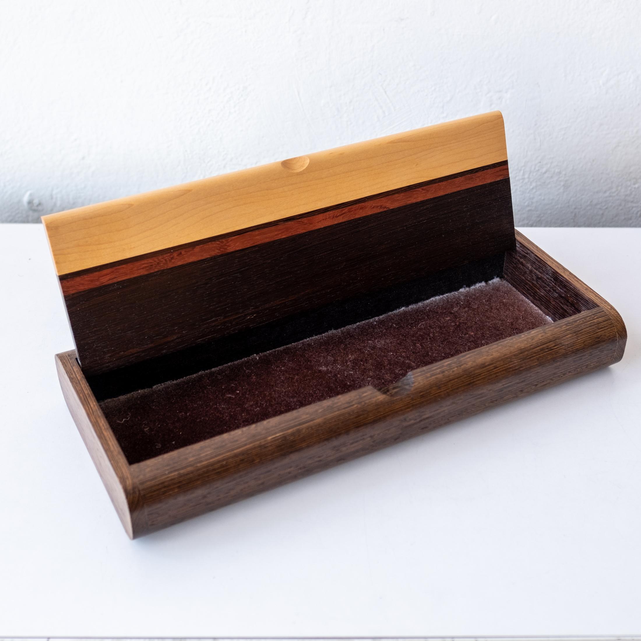 Amazing hand-crafted studio jewelry box. Wenge with other mixed exotic wood with incredible joinery. Suede-lined.