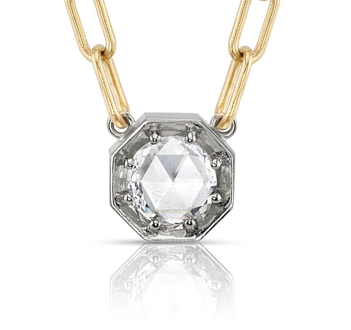 0.66ct E/SI1 GIA certified rose cut diamond prong set in a handcrafted 18K yellow and champagne white gold pendant necklace.

Necklace measures 17