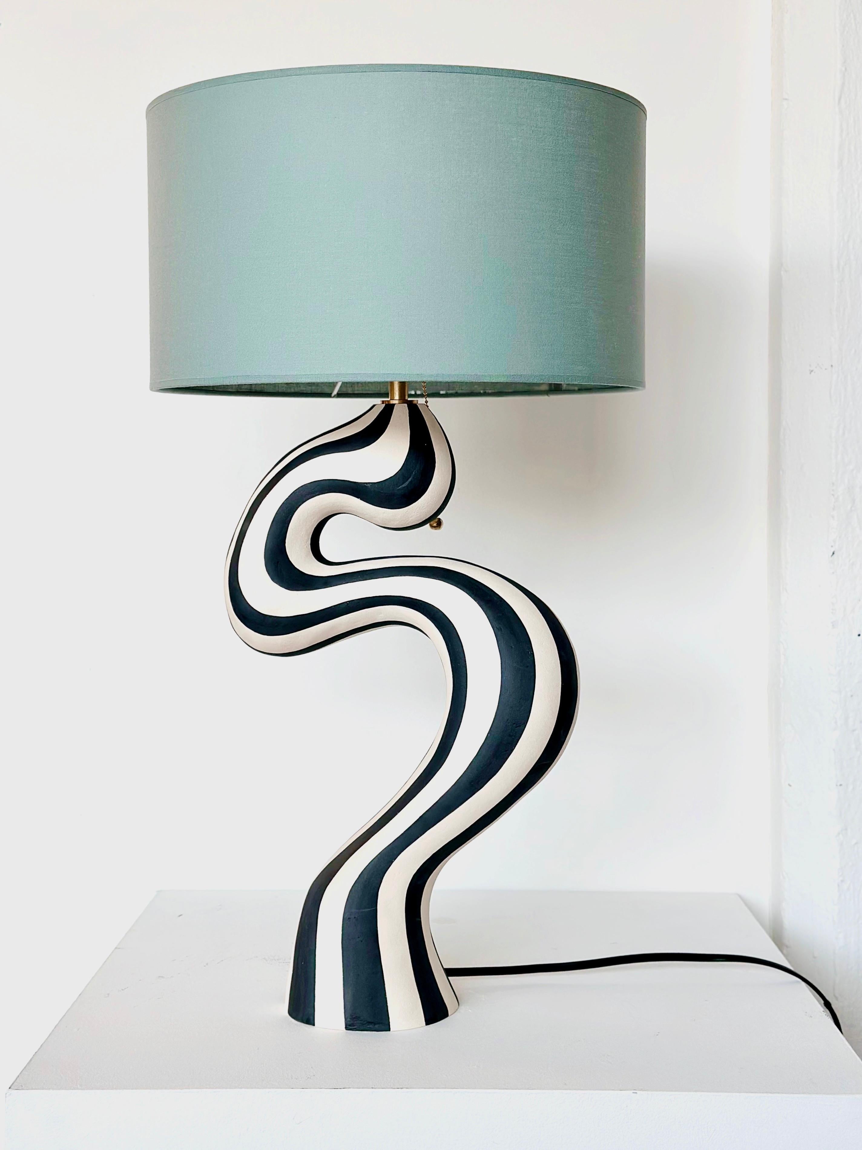 Handcrafted lamp base by Norwegian artist Johanne Birkeland. The lamp base is hand built in white stoneware clay, and hand decorated with black matte glaze. 

The lamp comes with North American wiring and brass E26 socket.

The Norwegian artist, who