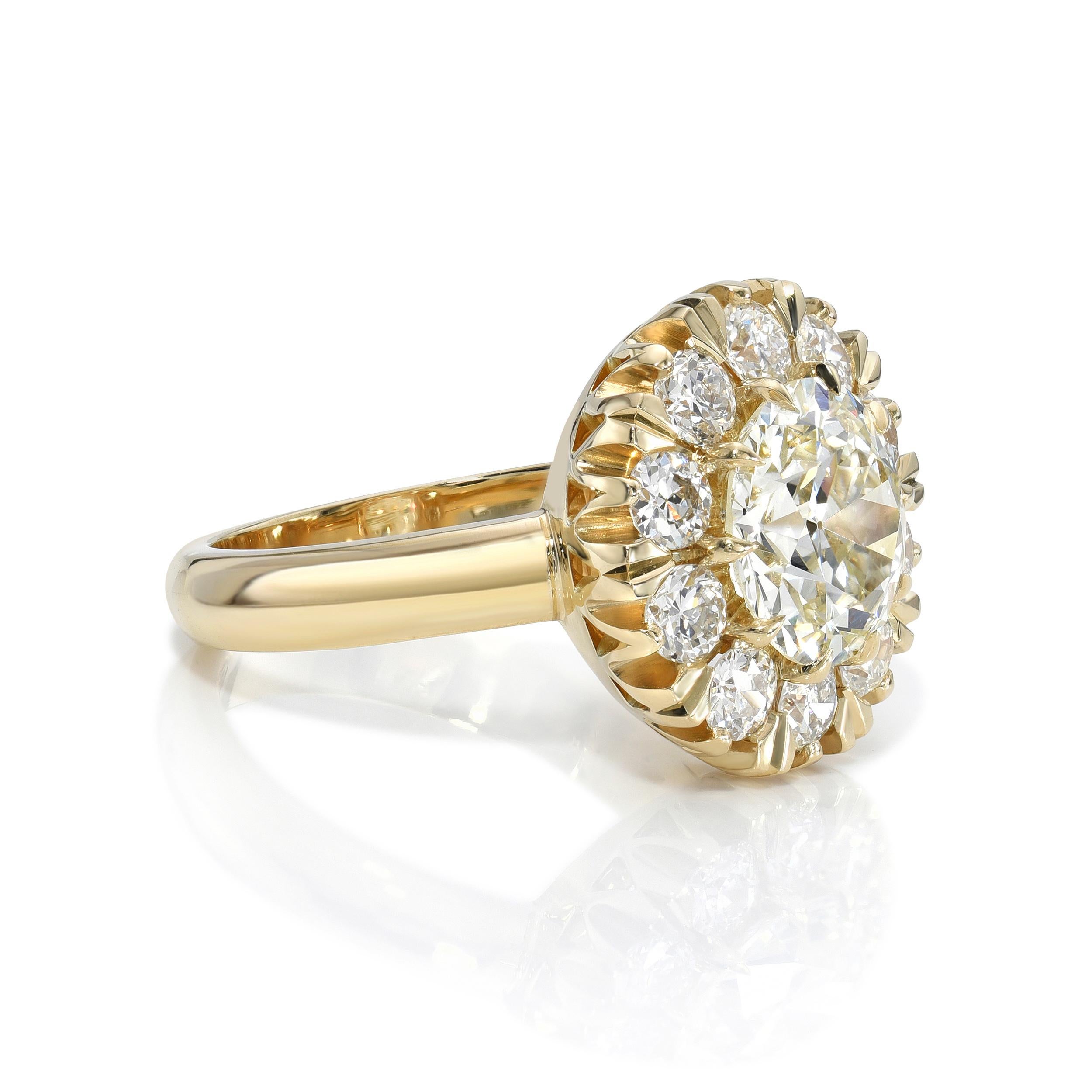 2.22ct N/VVS2 GIA certified old European cut diamond with 0.96ctw old European cut accent diamonds prong set in a handcrafted 18K yellow gold mounting.
