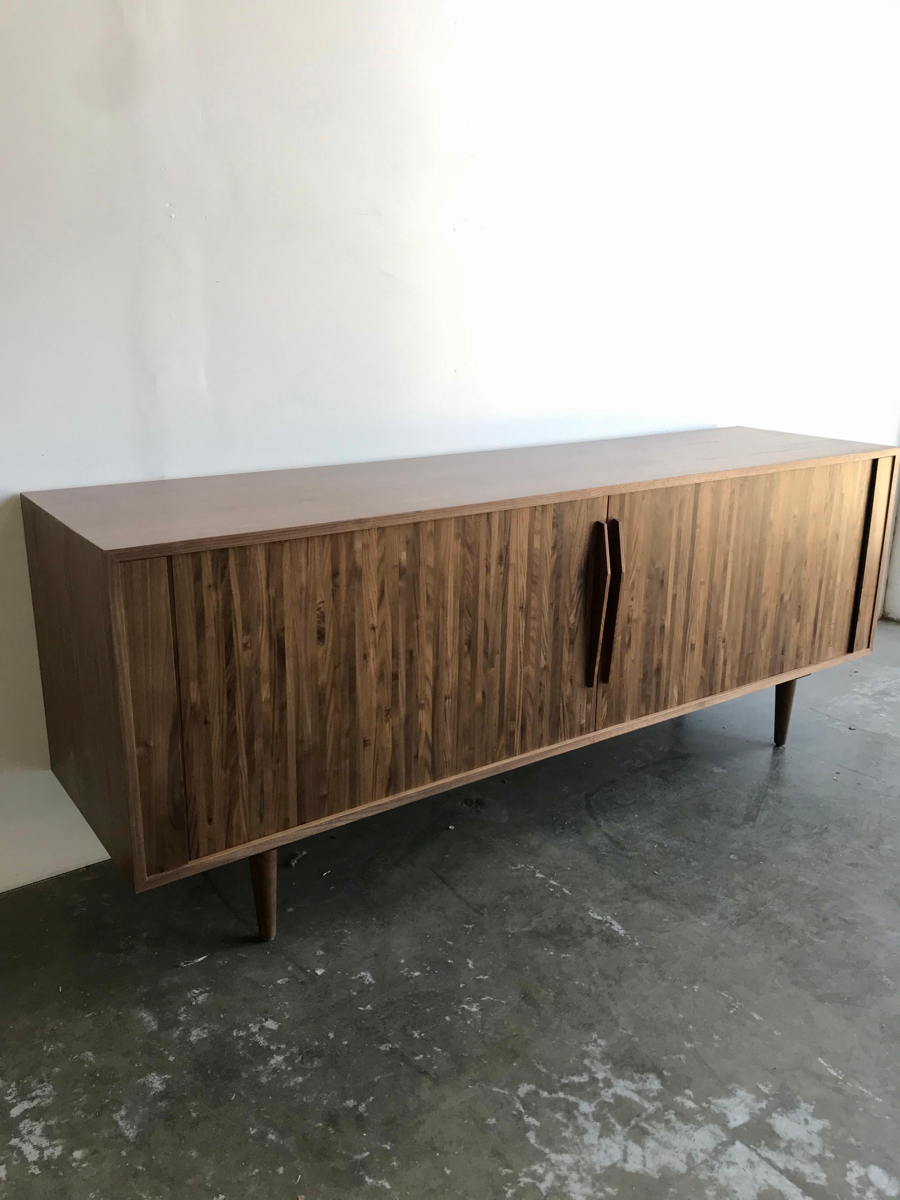 Handcrafted walnut tambour credenza. Items were built in house for a staging job. Items have been on displays with very little use and is in like new condition. Items offer ample hidden storage with both vertical and horizontal dividers behind