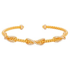 Bracciale artigianale con triplo segno dell'infinito in oro 22 carati e diamanti