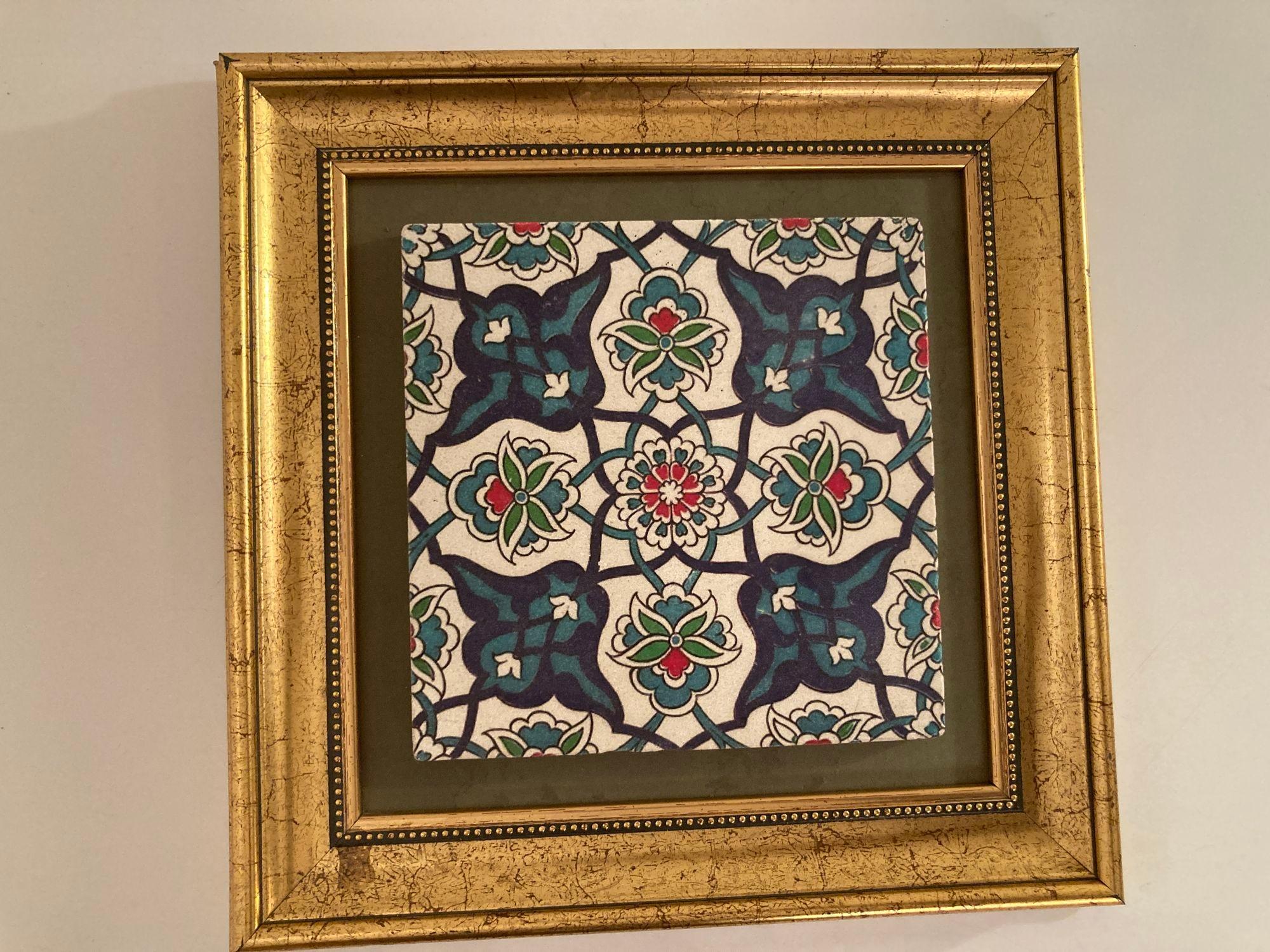 Handcrafted Turkish Iznik style pottery tile framed.
Turkish traditional Iznik tile with polychrome decoration of stylized flower designs in black, blue, green and turquoise on white background.
20th century Iznik pottery tile decorated with