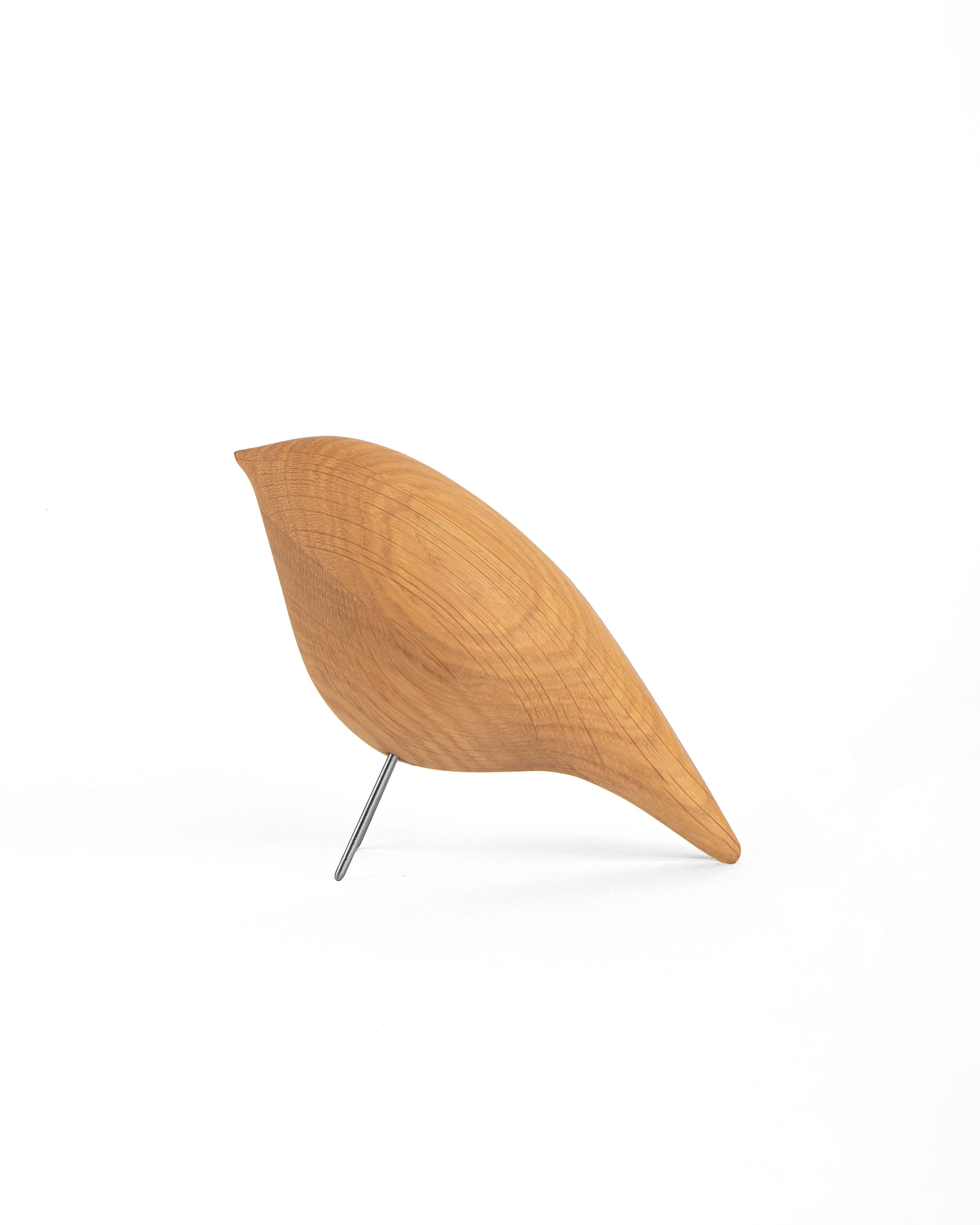 Bring a touch of whimsy to your home or office with the charming wooden bird from the Tweety series.

Designed by Kateryna Sokolova, this minimalist sculpture is an attractive accent piece that delightfully captures the beauty of
