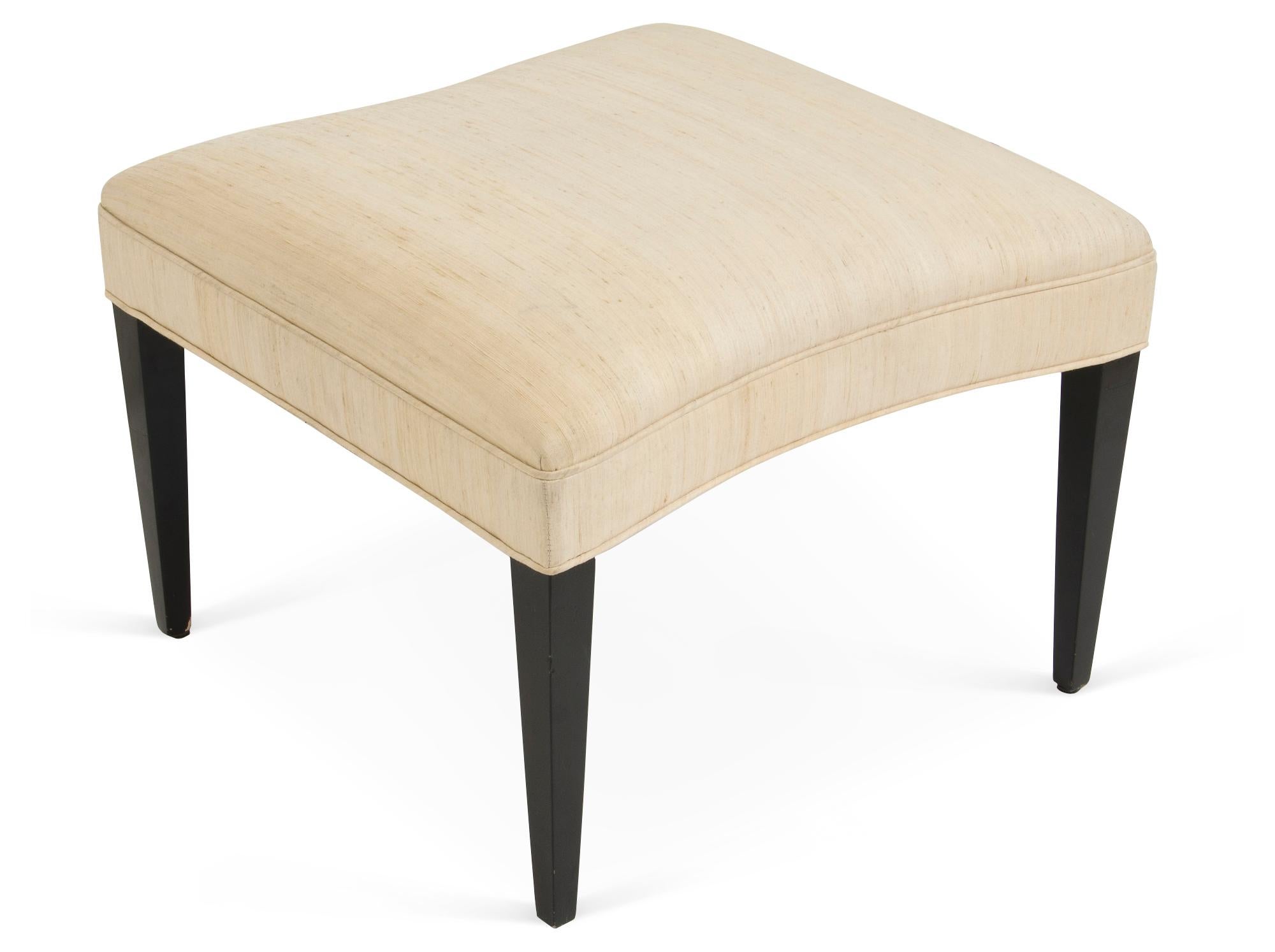 The handcrafted upholstered ottoman is built with tapered legs and convex sides to fit snugly within the matching cove chairs. Frame in alder or Walnut wood. Each piece is stamped.. Custom sizes and finishes available.
 