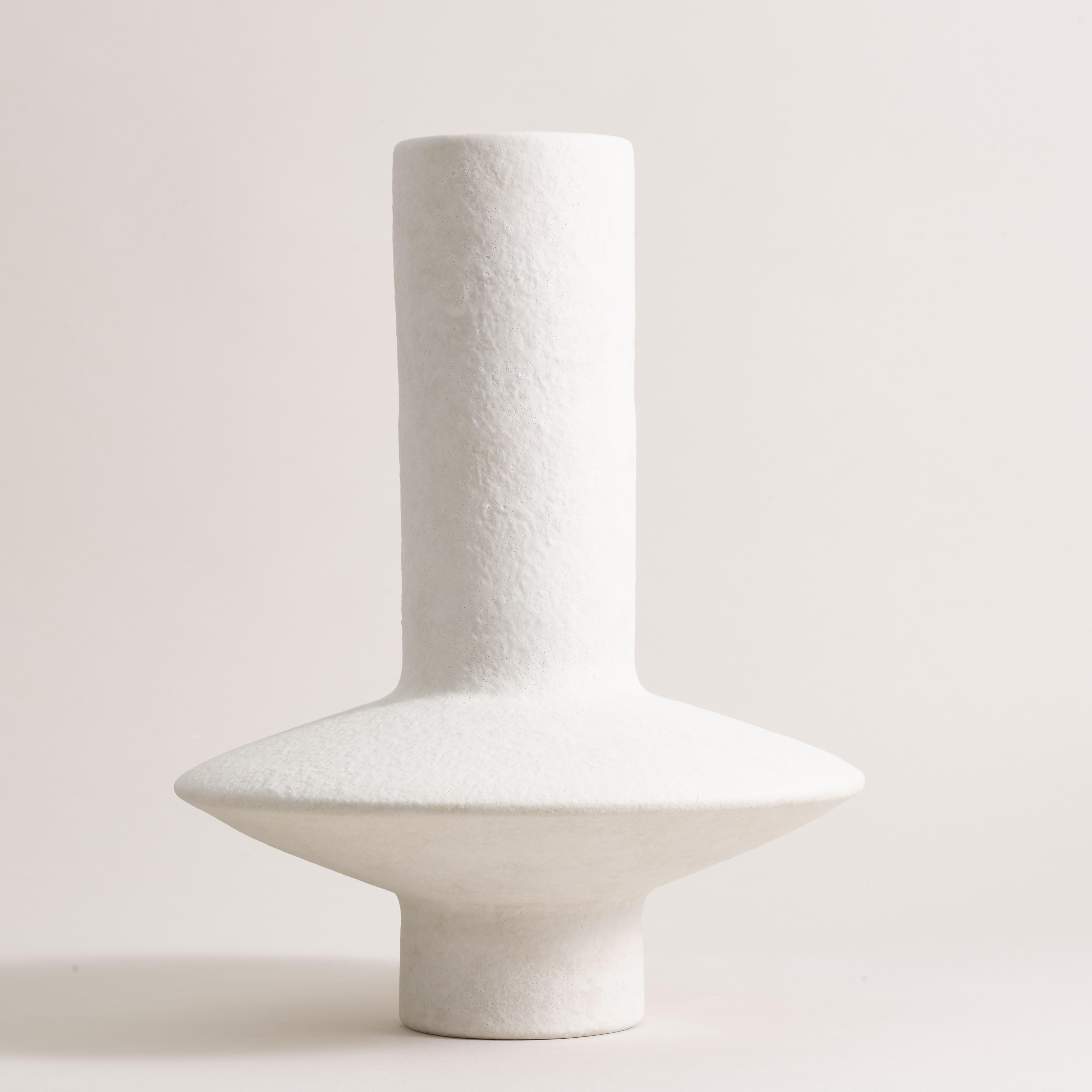 Handcrafted vase 072 by Lovebuch
Dimensions: Ø 28 x H 34 cm
Materials: Sandstone, porcelain, handcrafted piece.

Katia works with wood and clay, these raw, powerfully expressive materials are shaped to create a poetry of objects that inhabit our