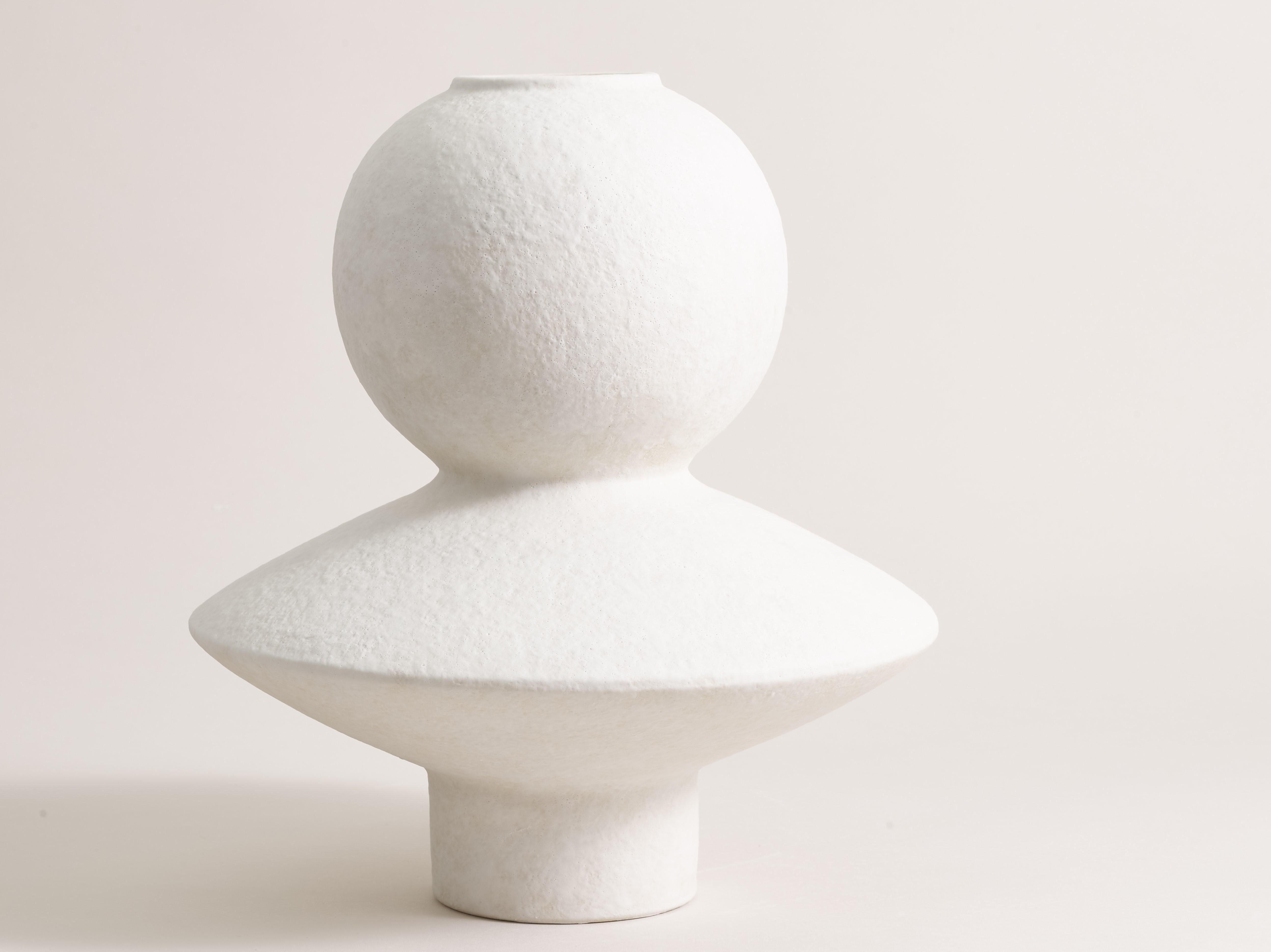 Handcrafted vase 074 by Lovebuch
Dimensions: Ø 25 x H 29 cm
Materials: Sandstone, porcelain, handcrafted piece

Katia works with wood and clay, these raw, powerfully expressive materials are shaped to create a poetry of objects that inhabit our