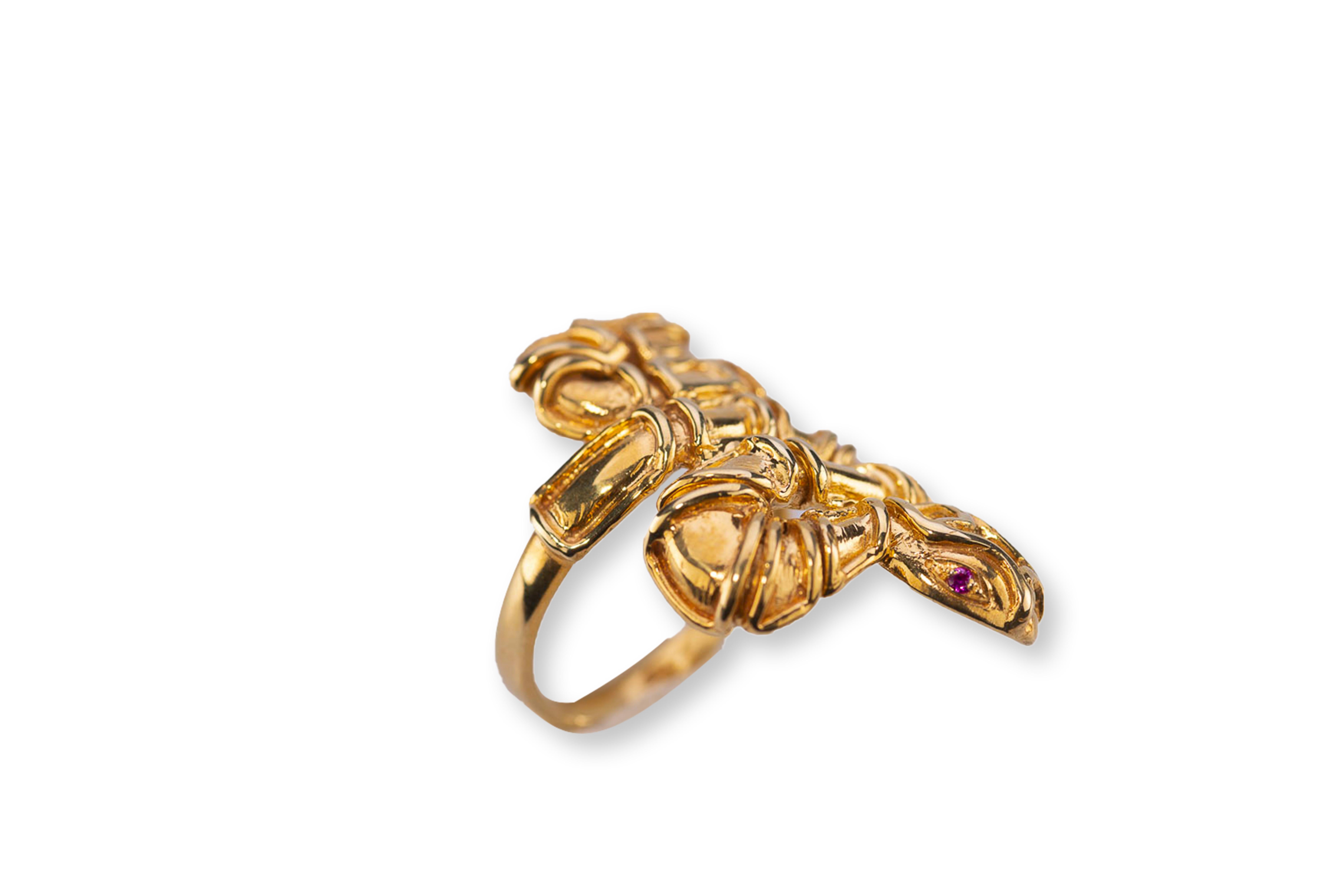 Delve into the captivating world of Rossella Ugolini, where artistry meets craftsmanship. Behold the handcrafted and hammered snake ring, exquisitely plated in Silver Sterling 24 Karats Yellow Gold with Rubies Eyes, delicately sized at 6.5 Usa size