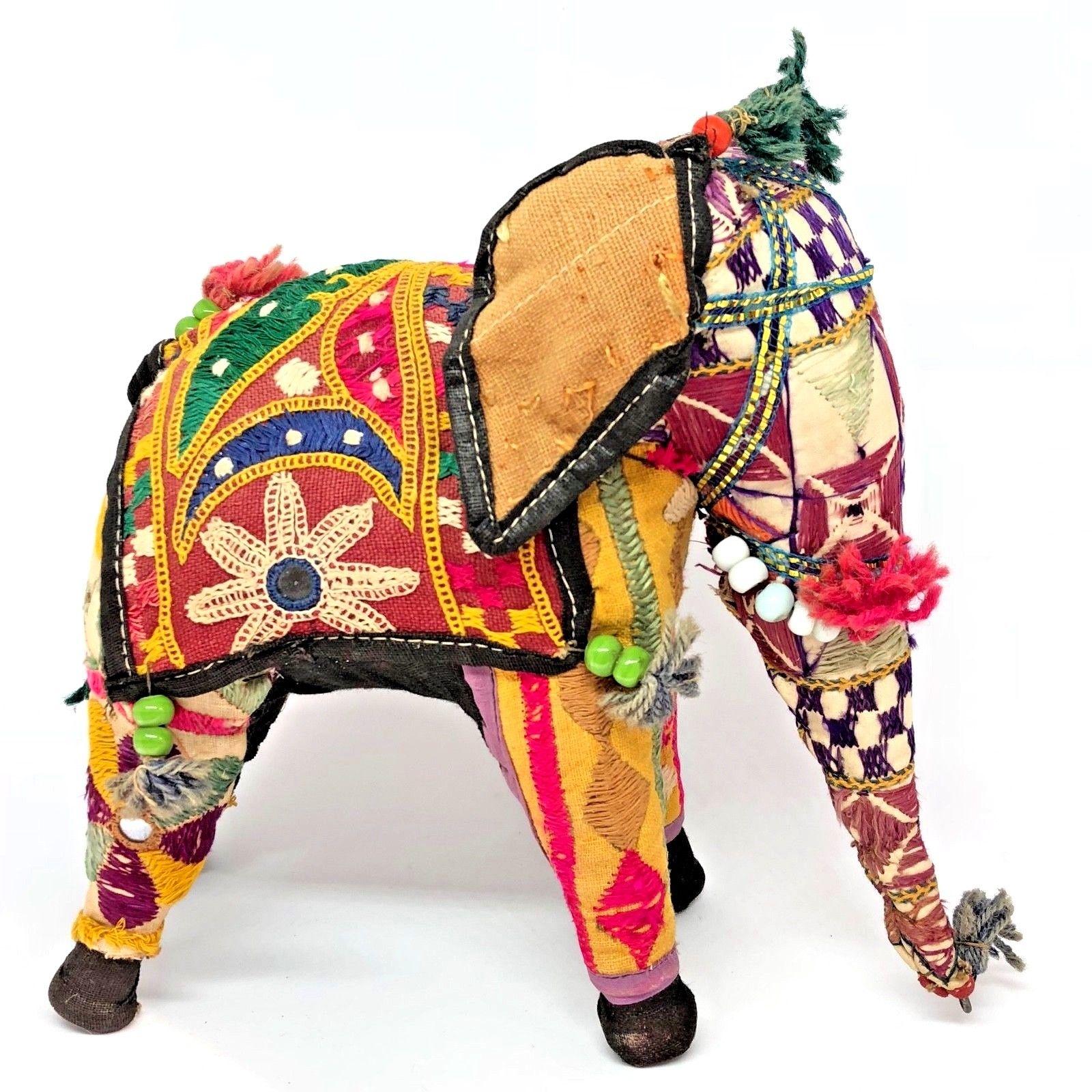 This handmade in India multi-color fabrics toy is truly a nice addition to your room . A vintage small elephant, stuffed, embroidered and decorated with small mirrors and glass pearls, great collector piece. Ceremonial elephant toy, Folk Art, circa