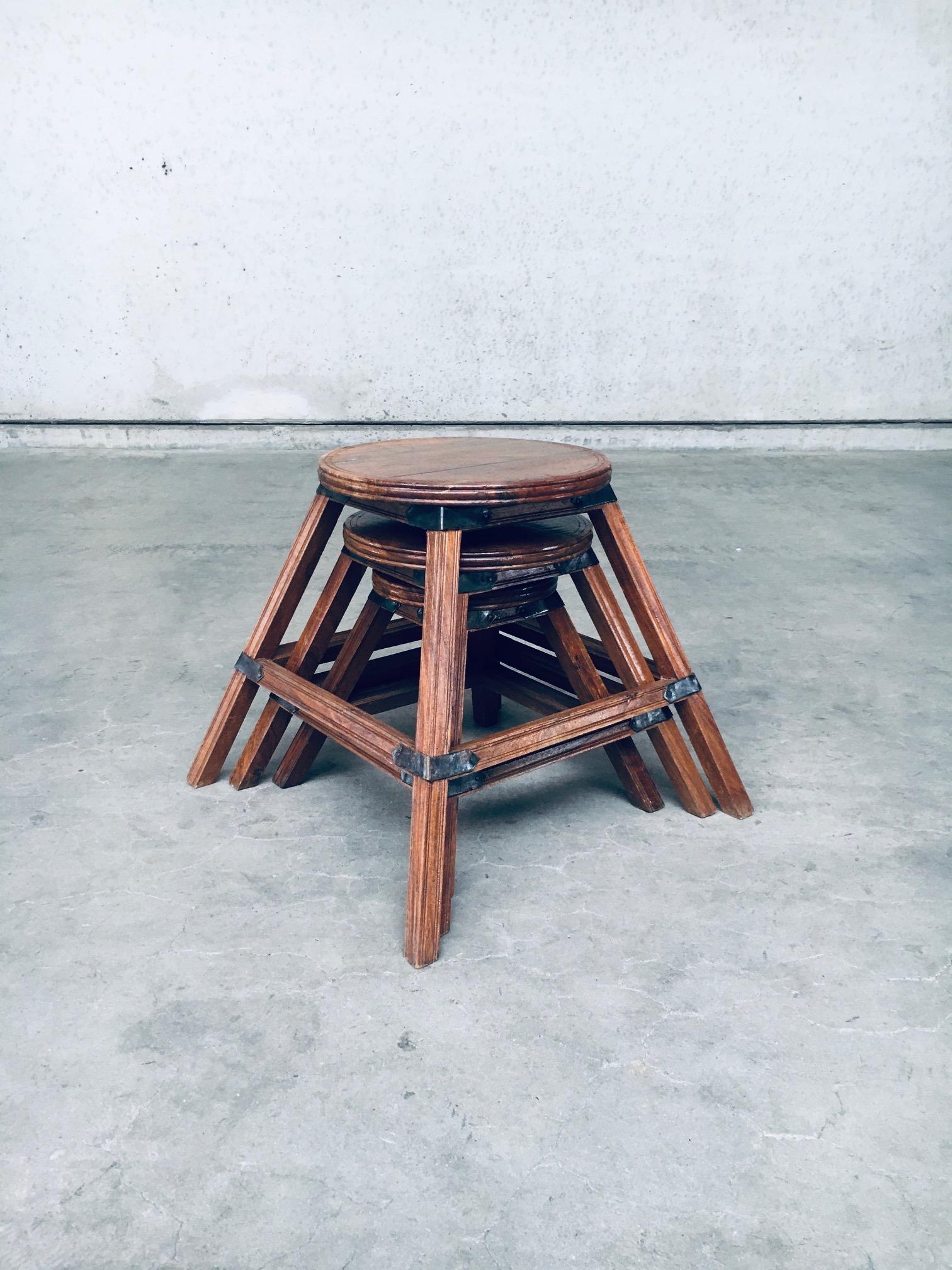 Vintage handcrafted Wabi Sabi style design nesting table set of 3. Made in France, 1940's / 50's. Handmade nesting side or plant table set of 3. Oak wood constructed tables with metal reinforcing brackets and plates. The three stools all fit nicely