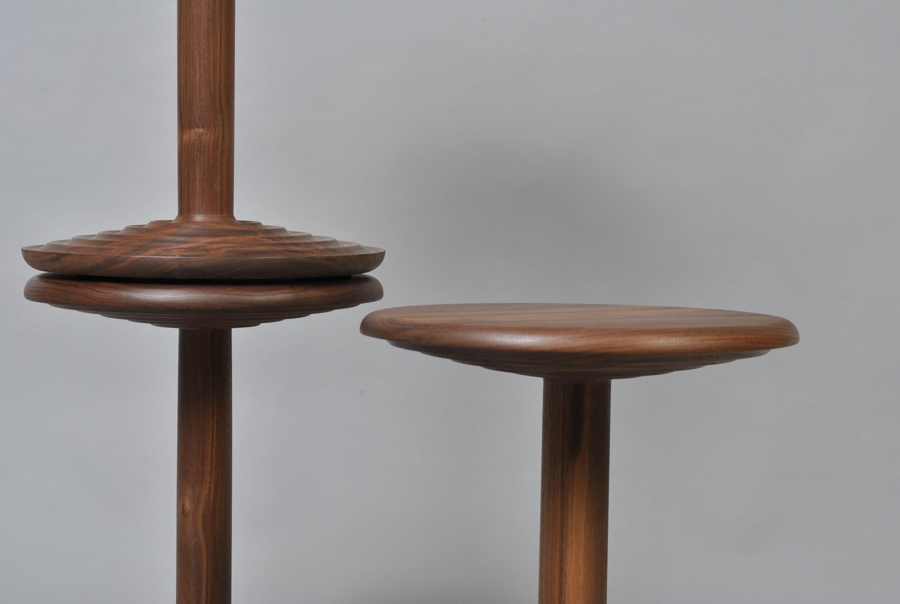 Beautifully turned and handcrafted walnut side table in modernist midcentury design. Perfect in form and scale. This is a bespoke piece of the finest quality, handmade by our master craftsman in the UK using American black walnut. Hand finished with